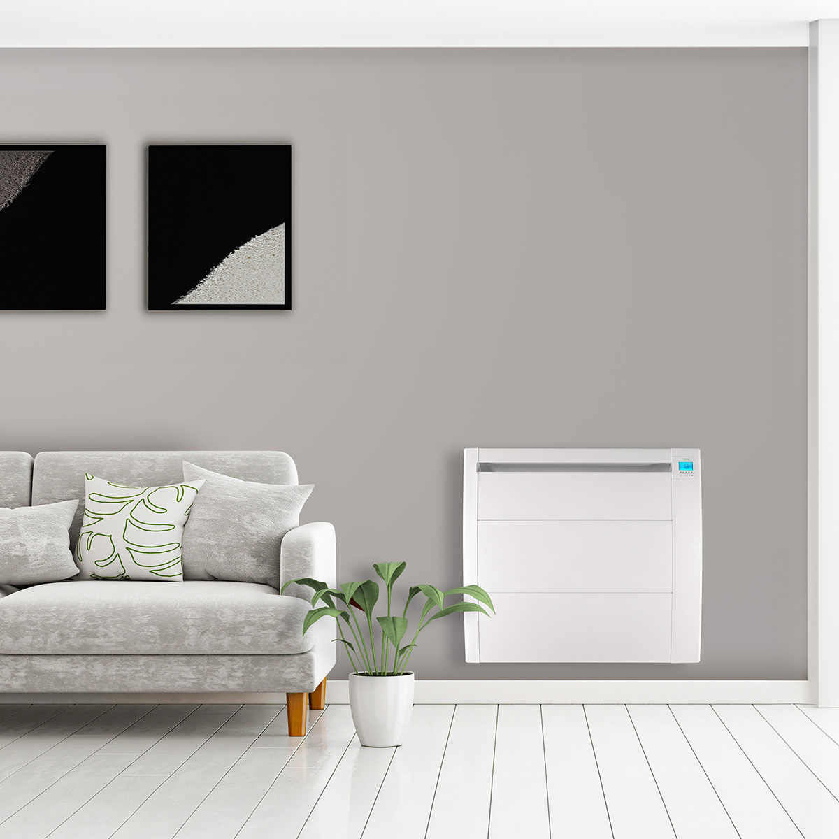 Una sala de estar con un sofá gris, dos cuadros enmarcados, un calentador blanco y una planta en maceta.