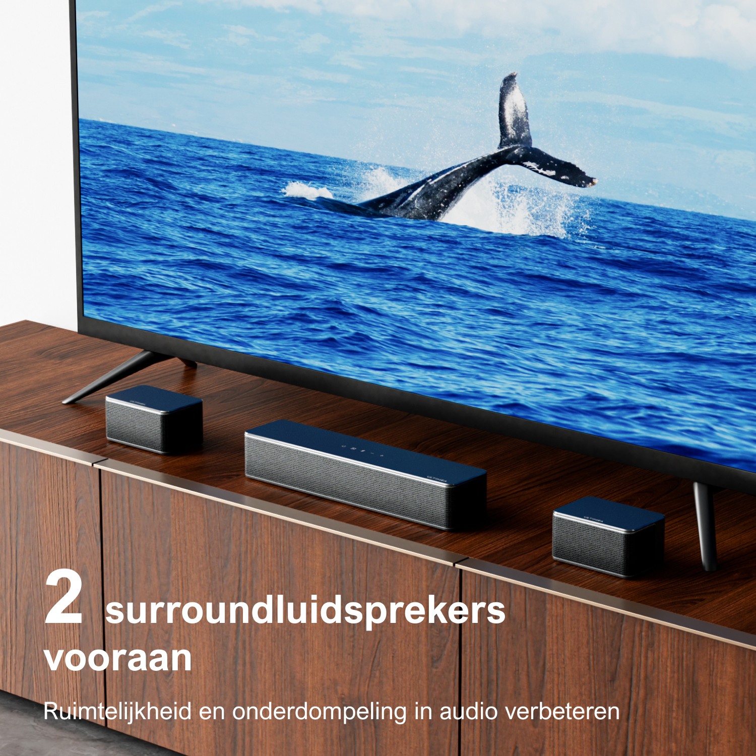 TV with whales in the ocean, two surround speakers and soundbar on a wooden cabinet.