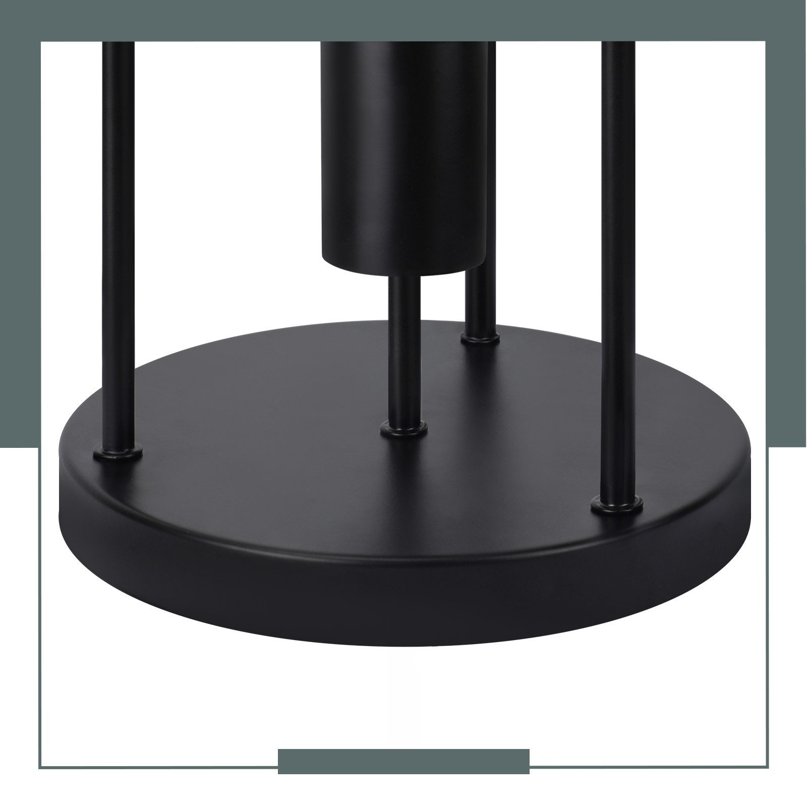 Czarna metalowa podstawa z pionowymi podporami, okrągła podstawa. Środek ma cylindryczną cechę.