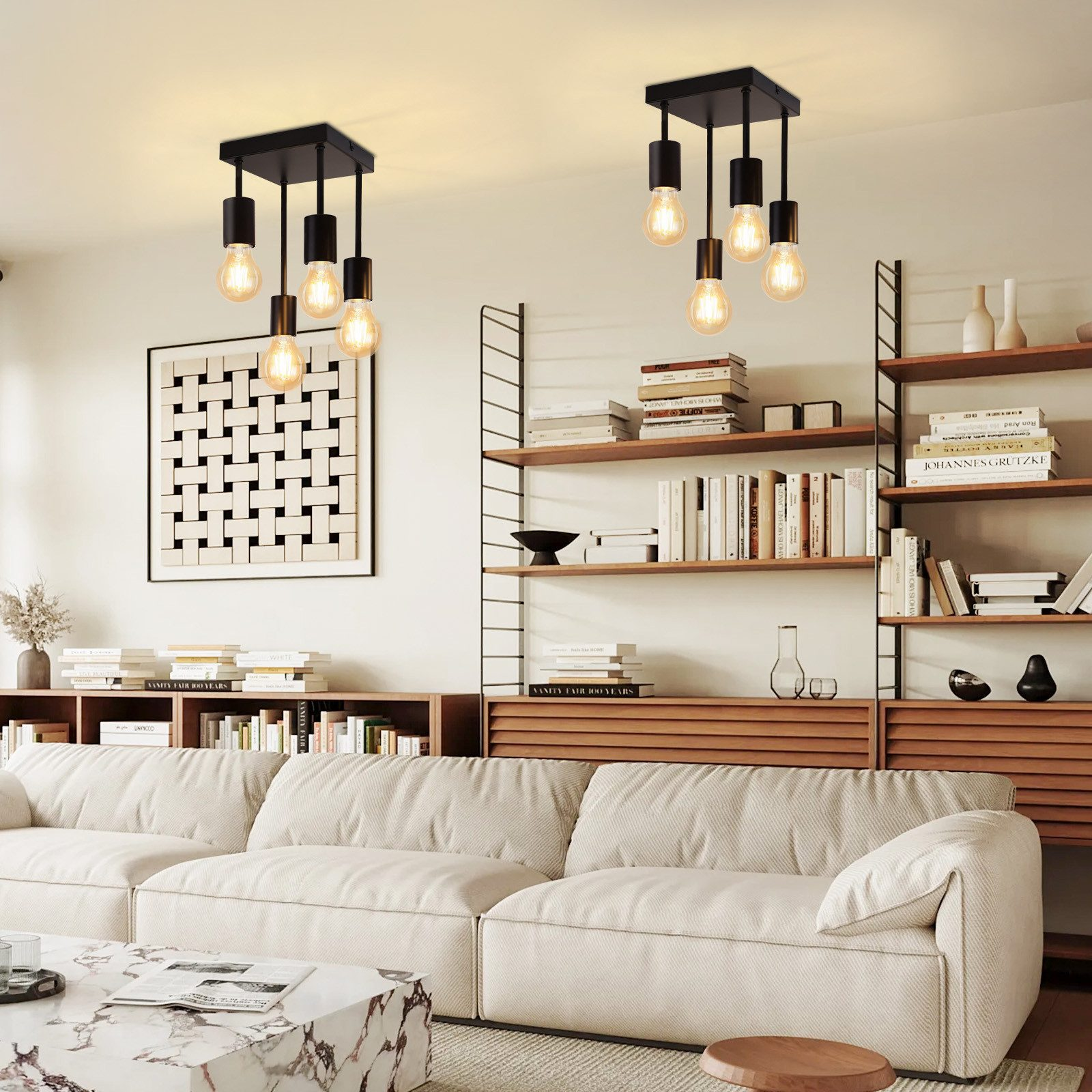 Wnętrze salonu z wiszącymi lampami, sofą i regałem z książkami.