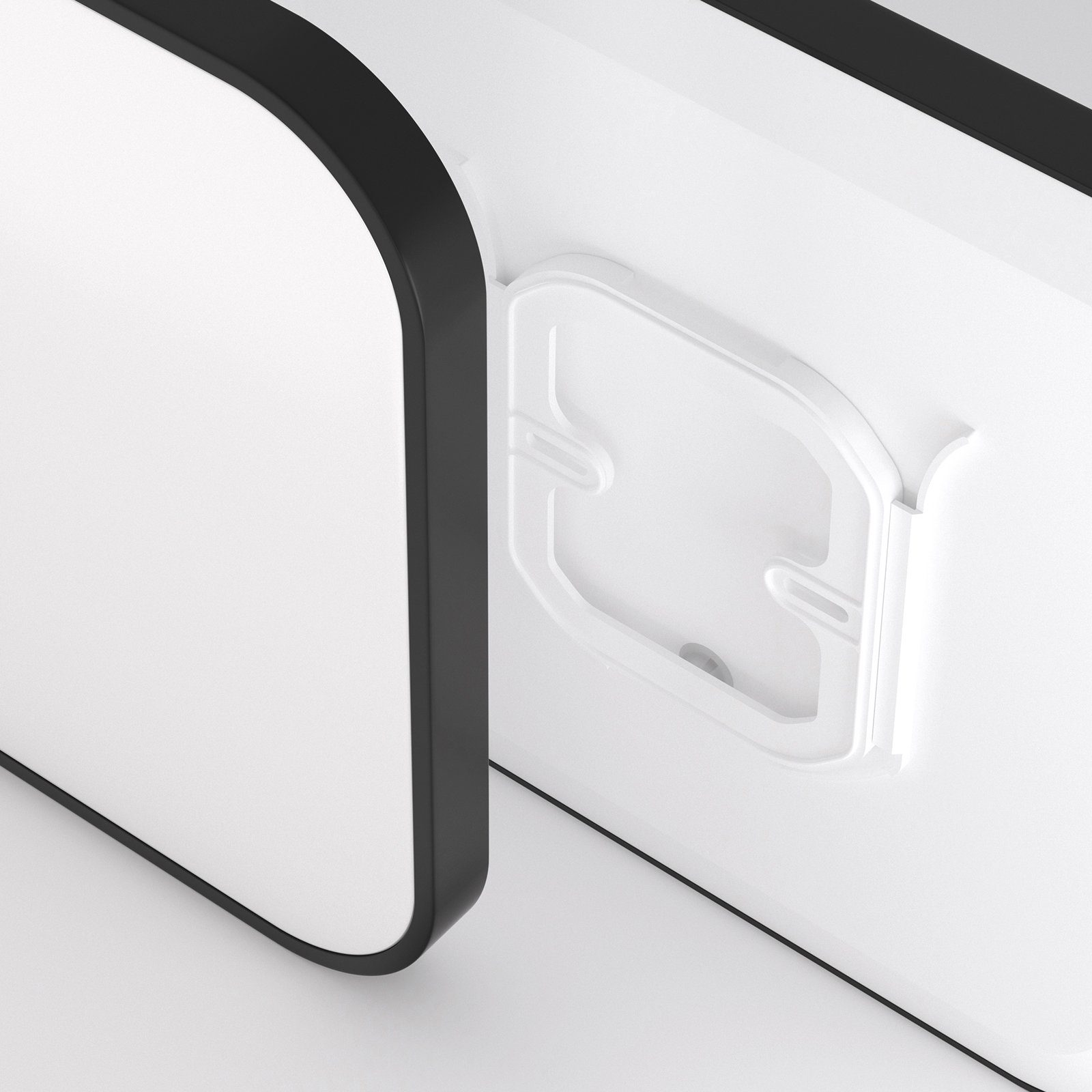 Białe drzwi z czarną ramą i białym plastikowym uchwytem. Drzwi są lekko otwarte.