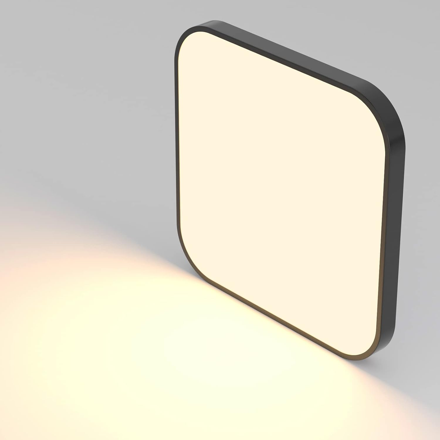 Nowoczesna kwadratowa oprawa oświetleniowa z jasnym, białym blaskiem. Czarna ramka i białe tło.