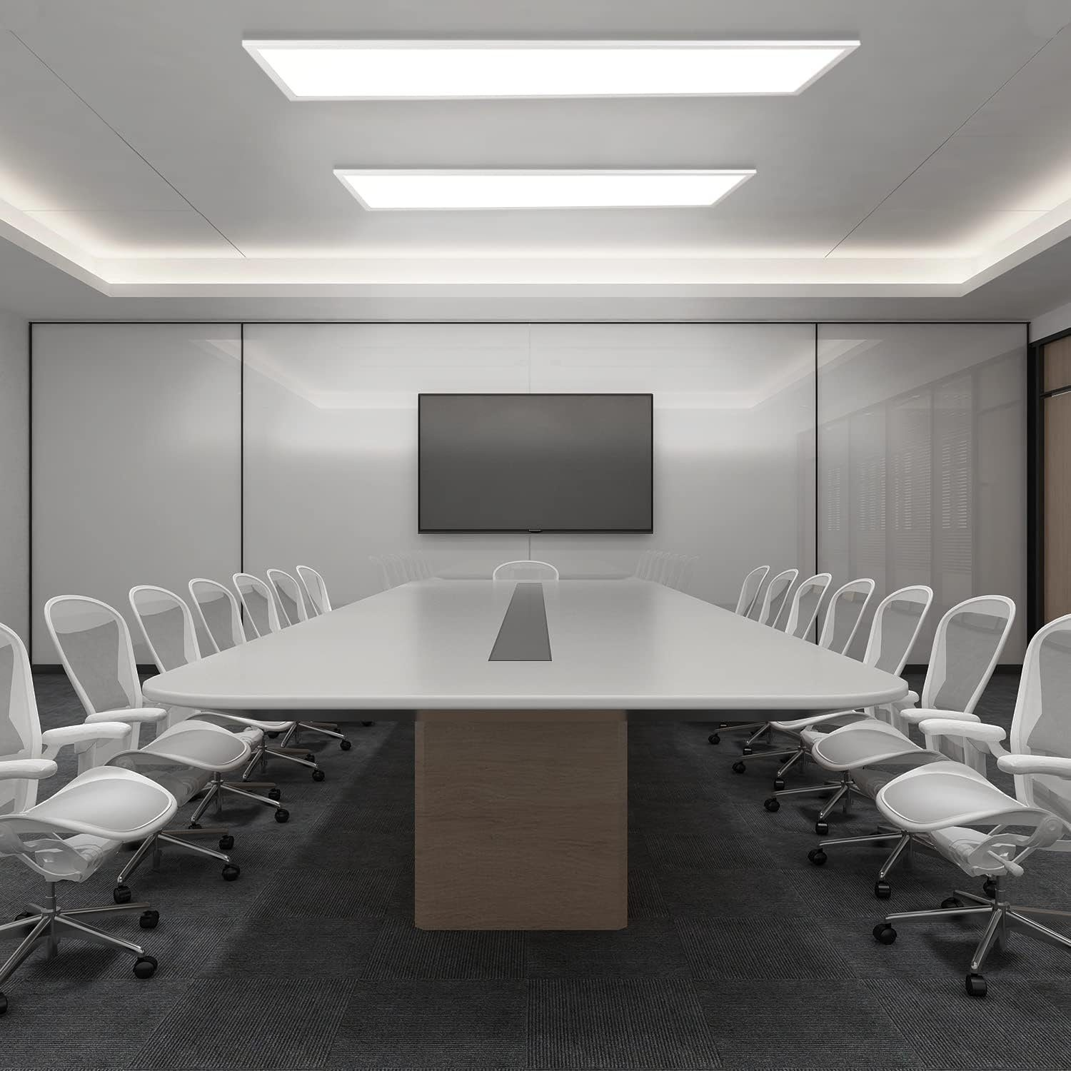 Una sala conferenze con un lungo tavolo, sedie bianche e un grande schermo.