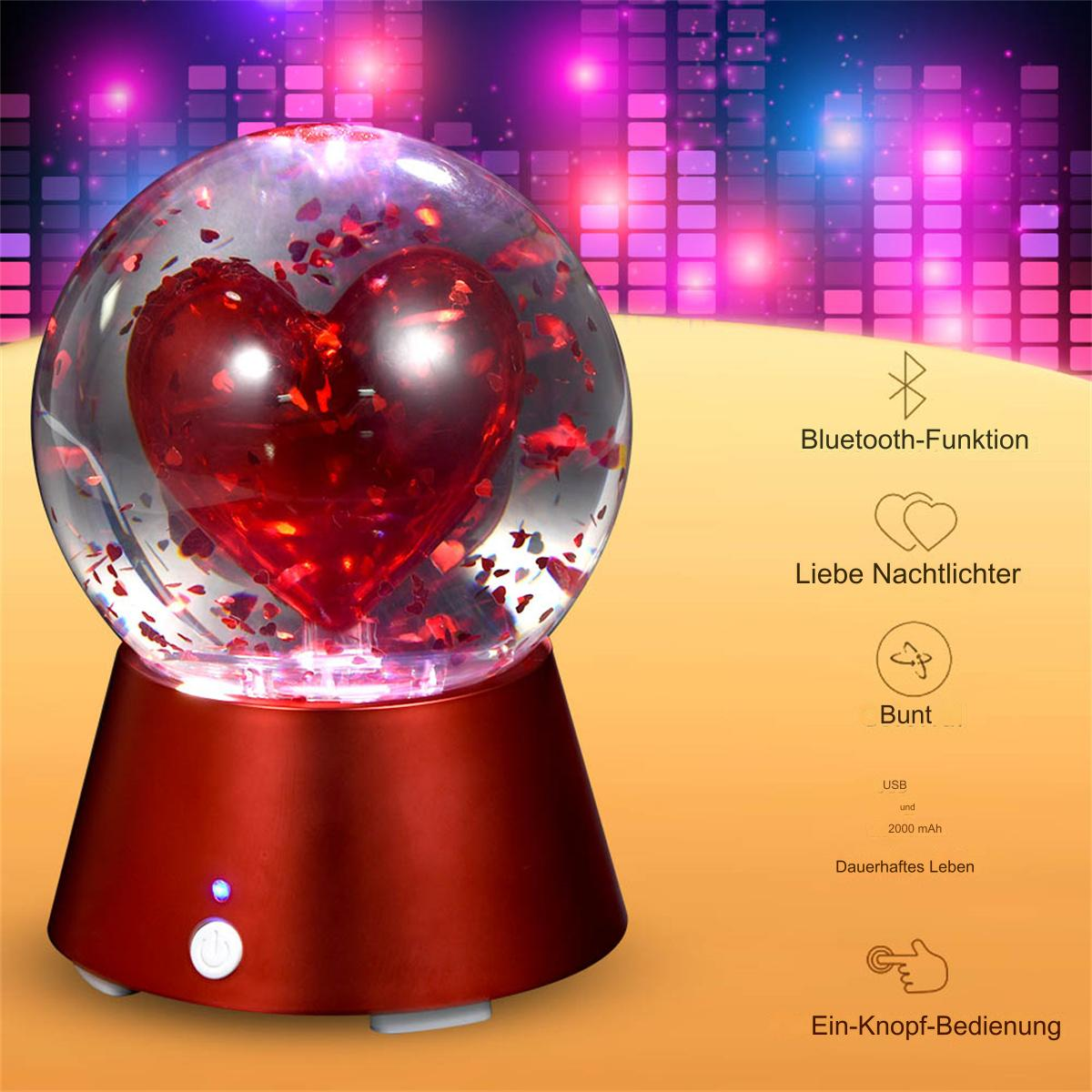 Eine rot-basierte Lampe mit herzförmigem Design in einer Glaskugel, mit roter Basis.