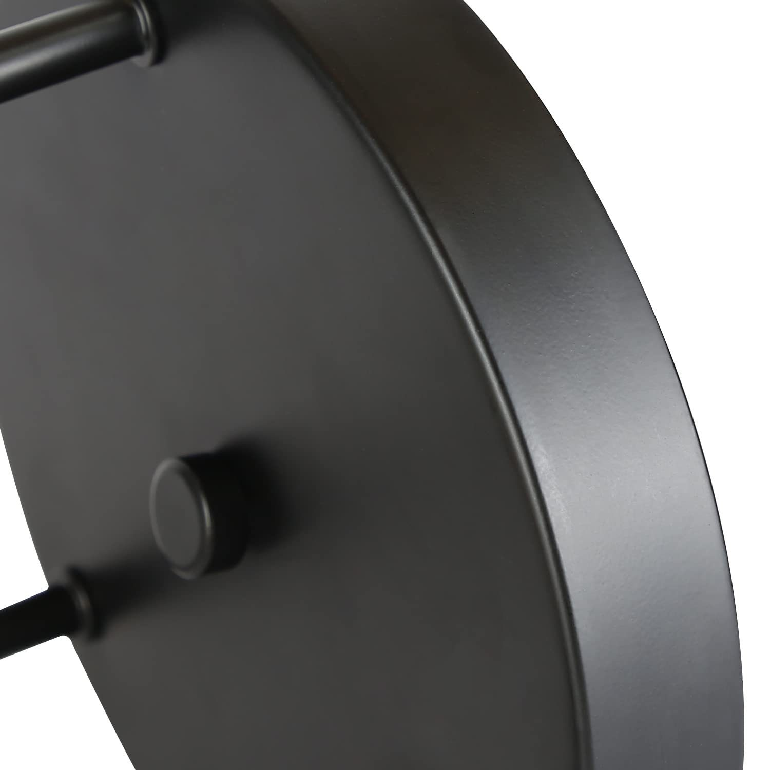 Oggetto circolare nero con tre gambe. Finitura opaca con bordo arrotondato. Sfondo bianco.