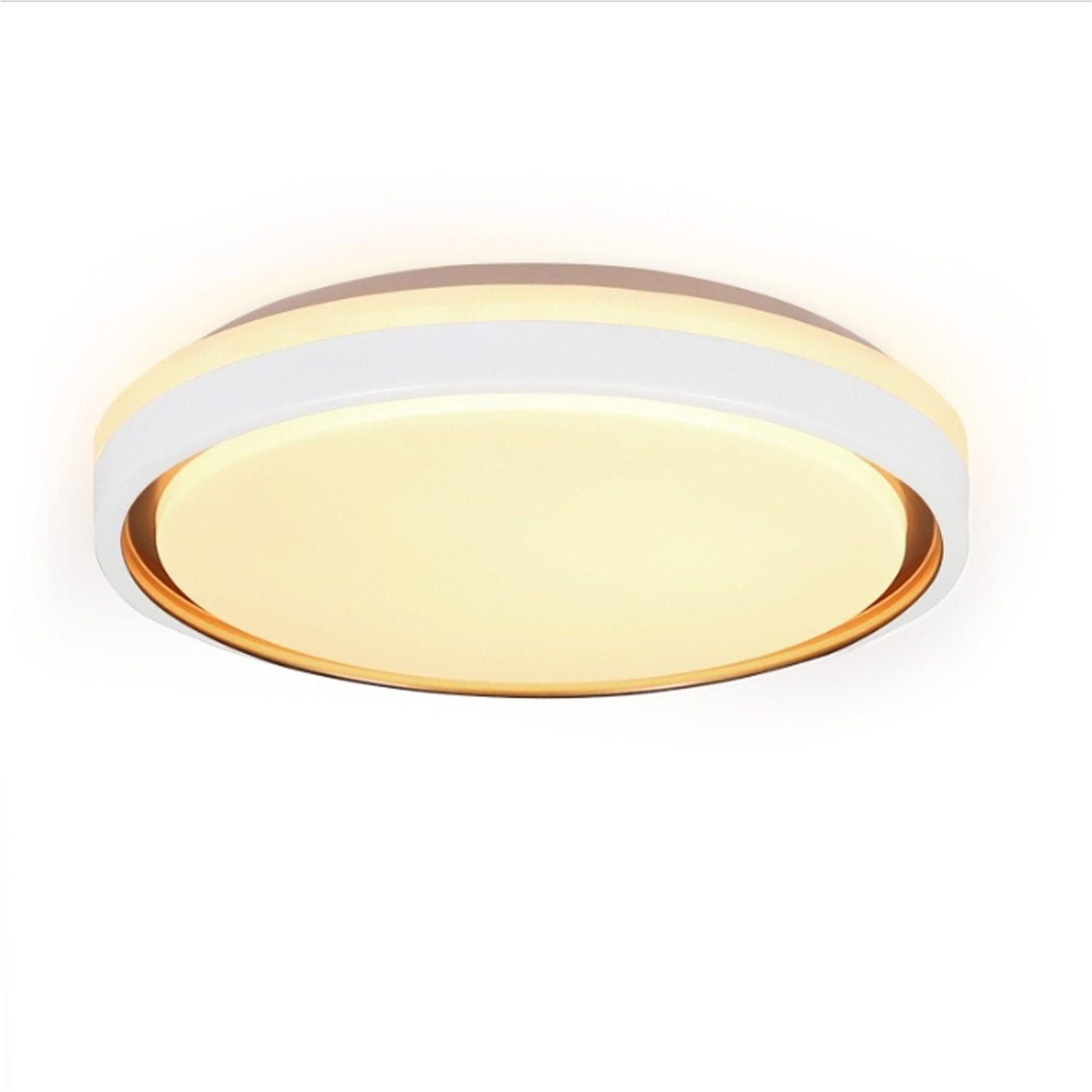 Biała lampa sufitowa, okrągły kształt ze złotym wnętrzem. Białe tło i światło.