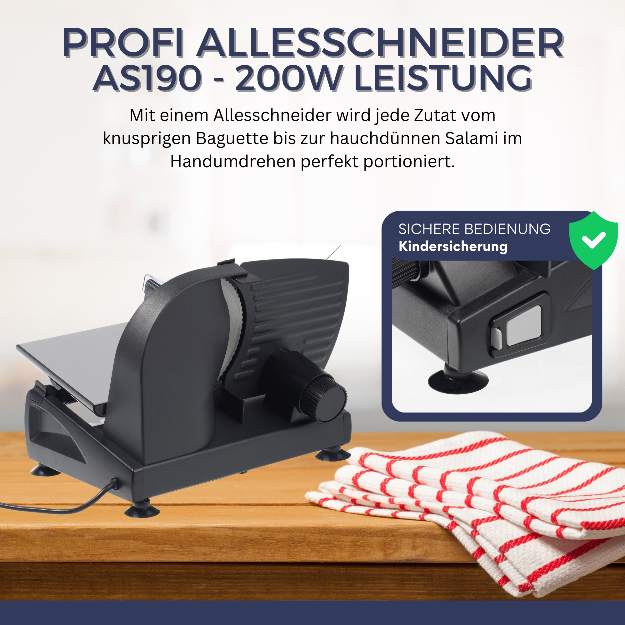 Eine schwarze Aufschnittmaschine auf einem Holztisch mit einem rot-karierten Handtuch.