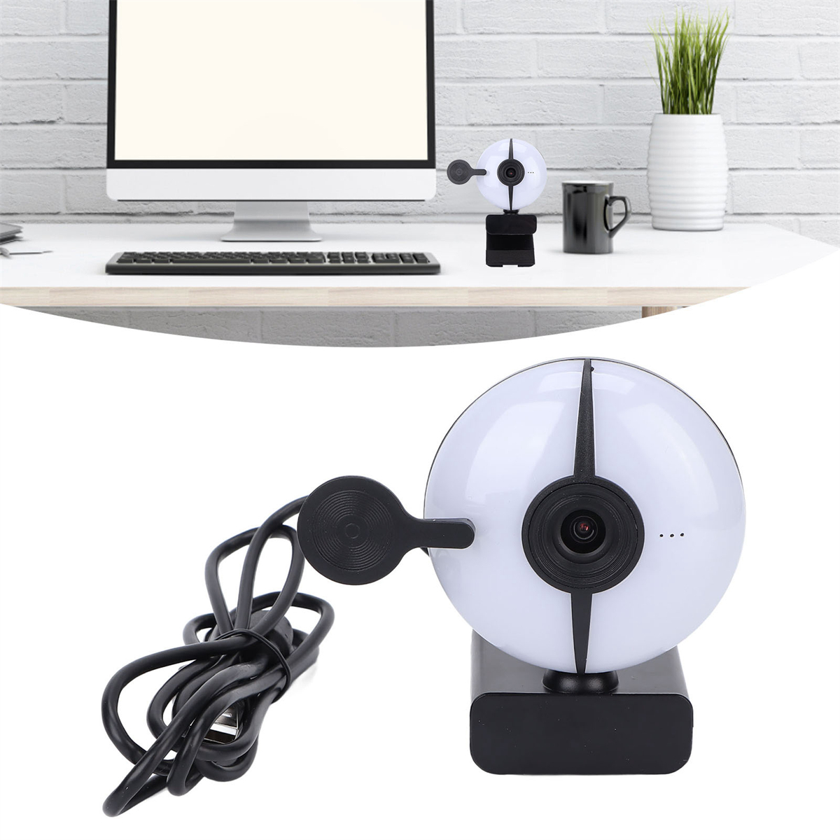 Webcam-Setup mit Computer, Monitor und einer schwarz-weißen Webcam.