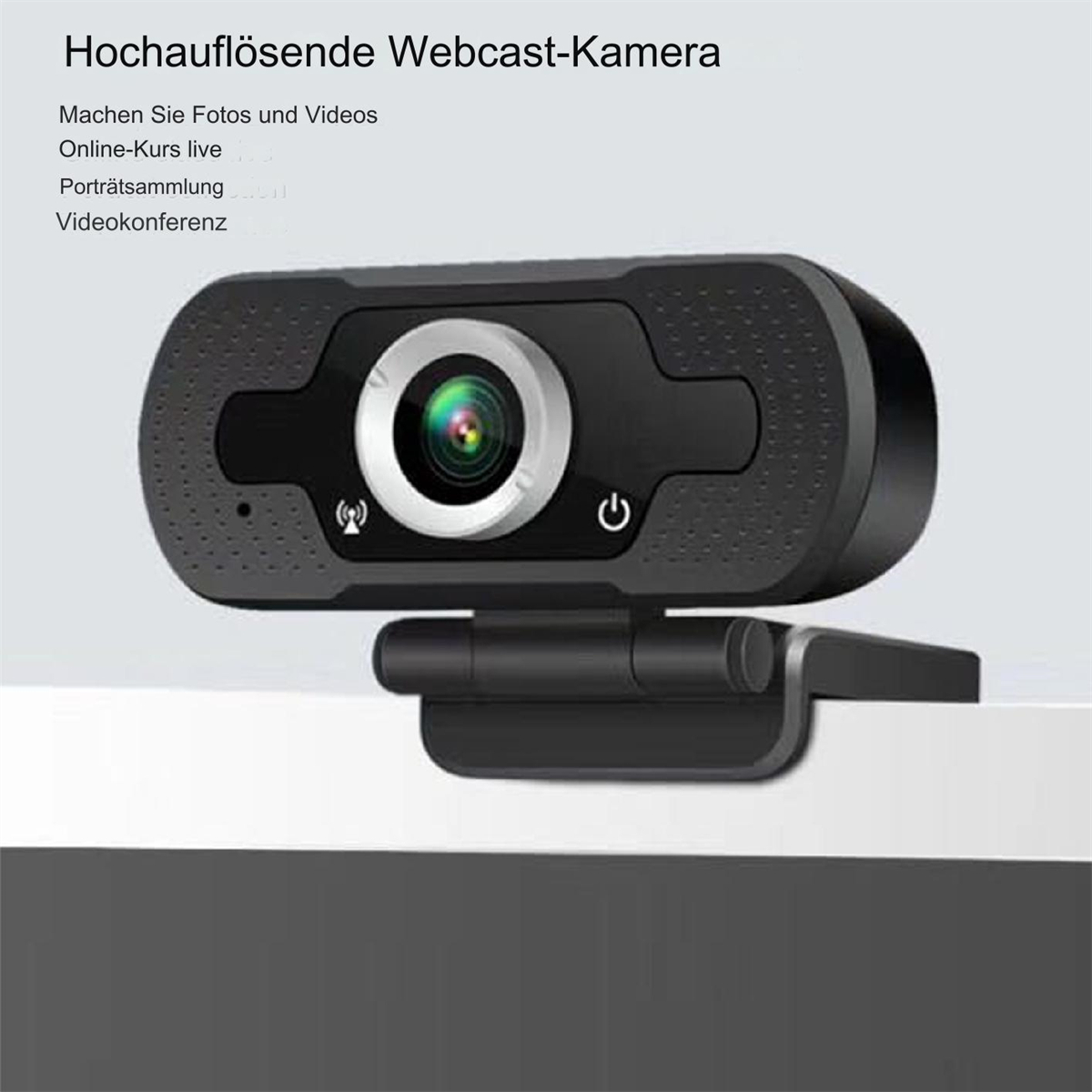 Schwarze Webcam auf weißer Oberfläche. Es hat eine Linse und zwei Knöpfe. Der Hintergrund ist unscharf.