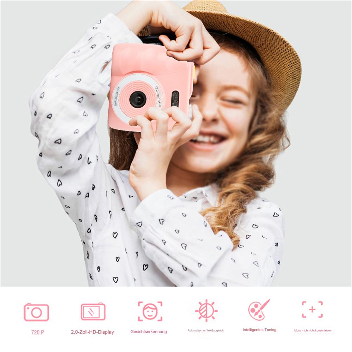 Ein Mädchen mit einer rosa Kamera lächelt. Unten sind Symbole zu sehen.