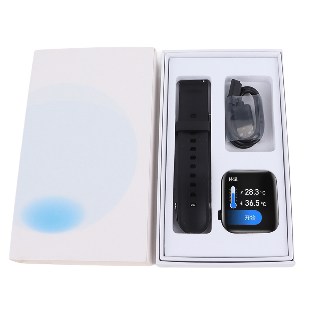 Smartwatch in Box, schwarzes Armband, Ladegerät und Anzeige mit Temperatur.