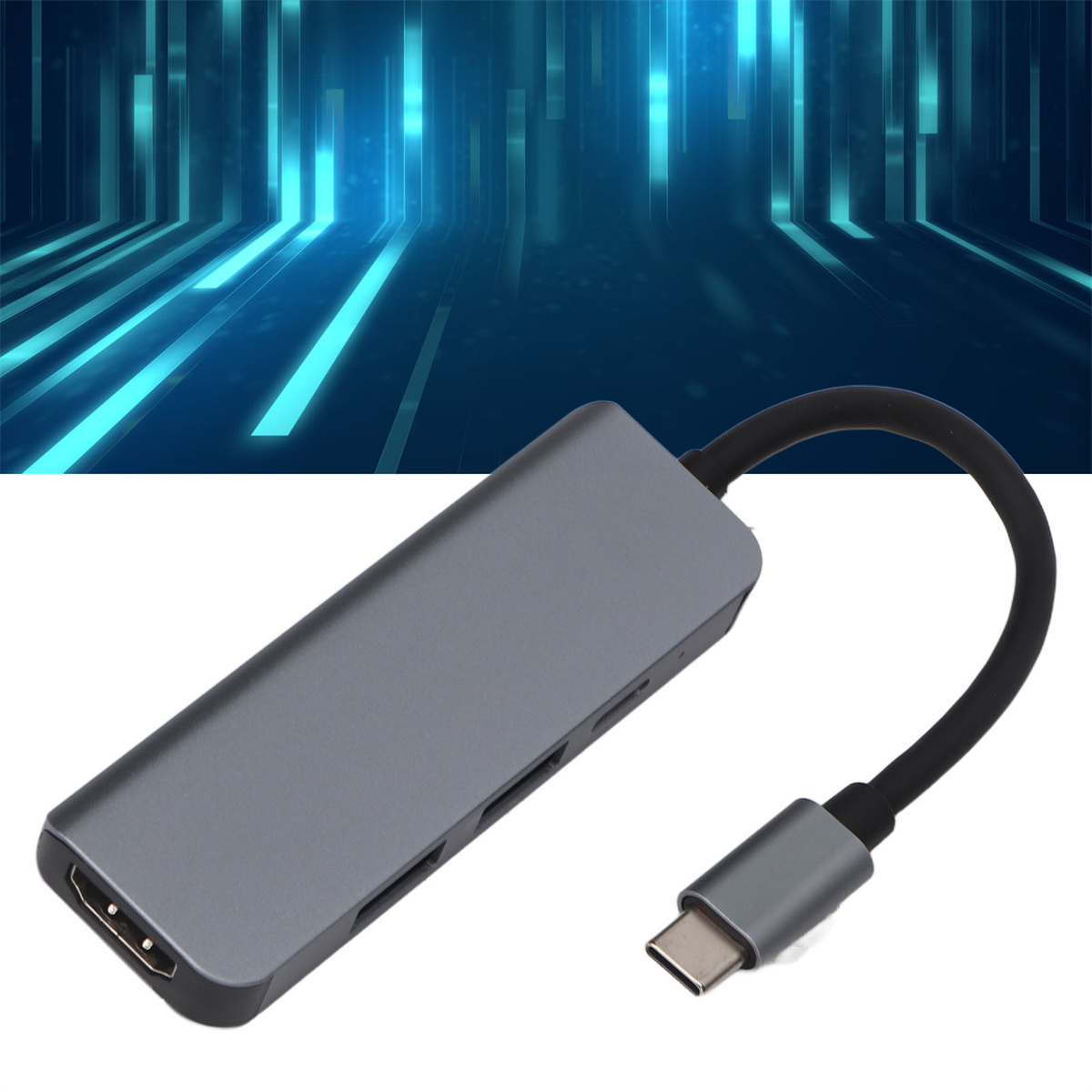 Ein grauer USB-C-Hub mit schwarzem Kabel vor blauem, technologiebasiertem Hintergrund.