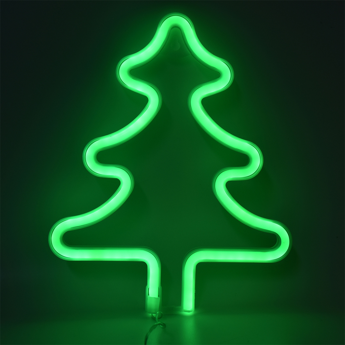 Neon-grüne Weihnachtsbaumkontur auf dunklem Hintergrund.
