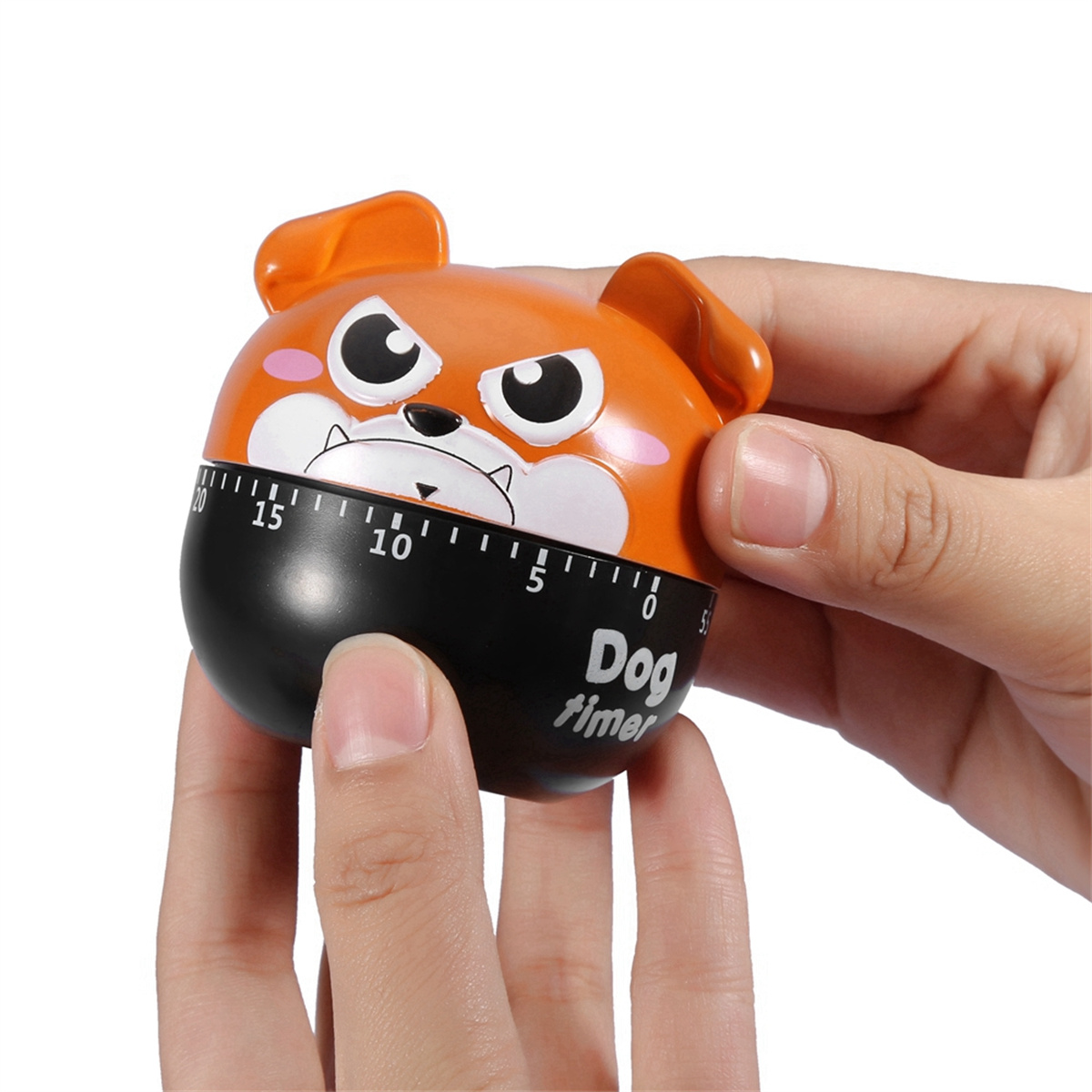 Hundeförmiger Küchentimer mit schwarzem Timer und orangefarbenem Gesicht. Hände halten ihn.