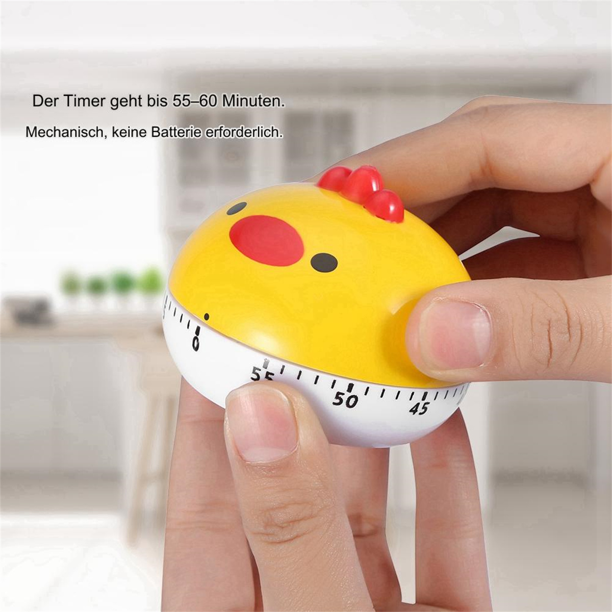 Ein gelber Küchentimer in Form eines Küken, mit Händen, die ihn halten. Der Timer zeigt 55-60 Minuten an.