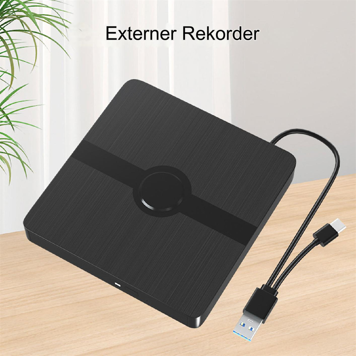 Schwarzer externer DVD-Rekorder. Angeschlossen an ein USB-Kabel. Text oben: 'Externer Rekorder'.