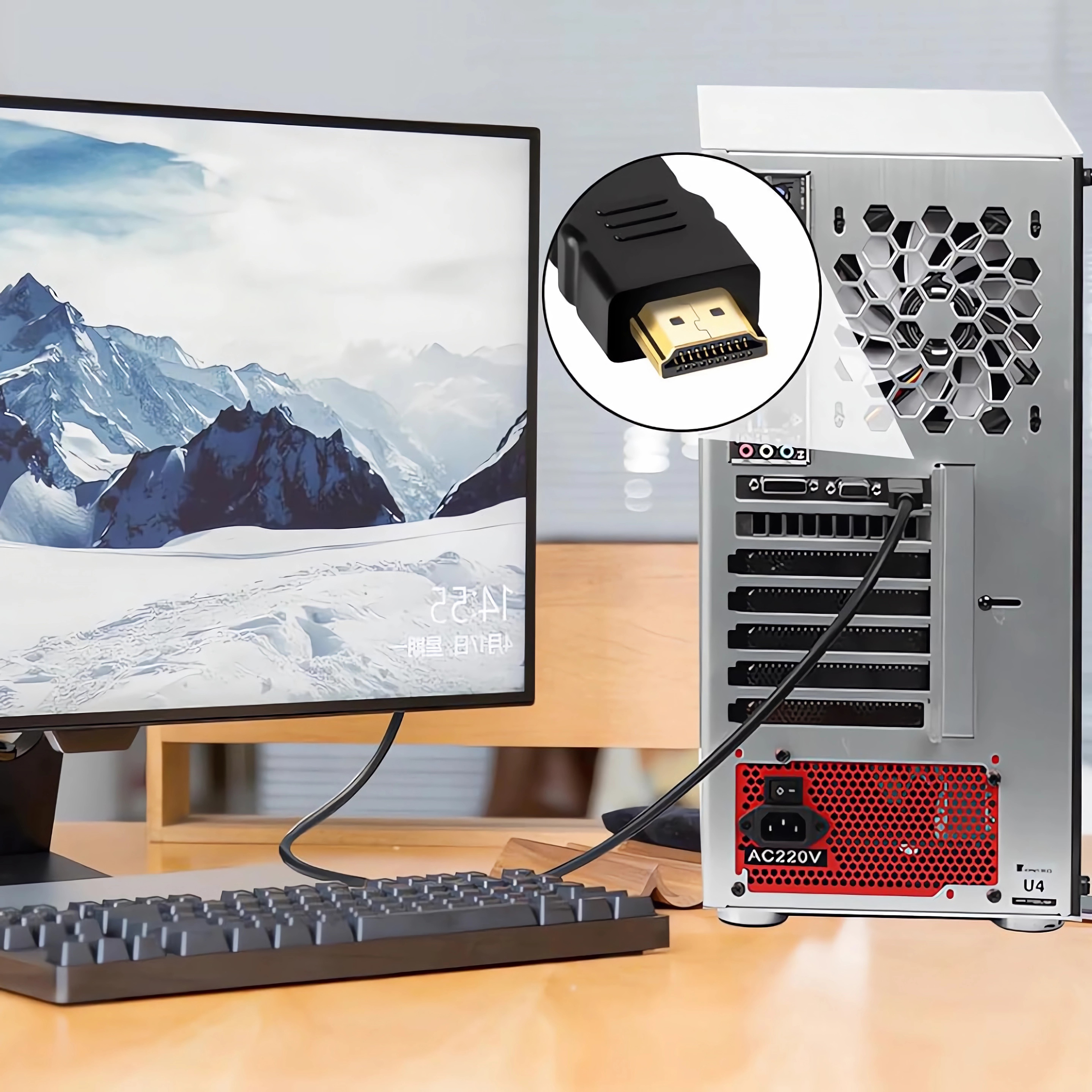 Computermonitor, Tastatur und Computerturm mit angeschlossenem HDMI-Kabel.