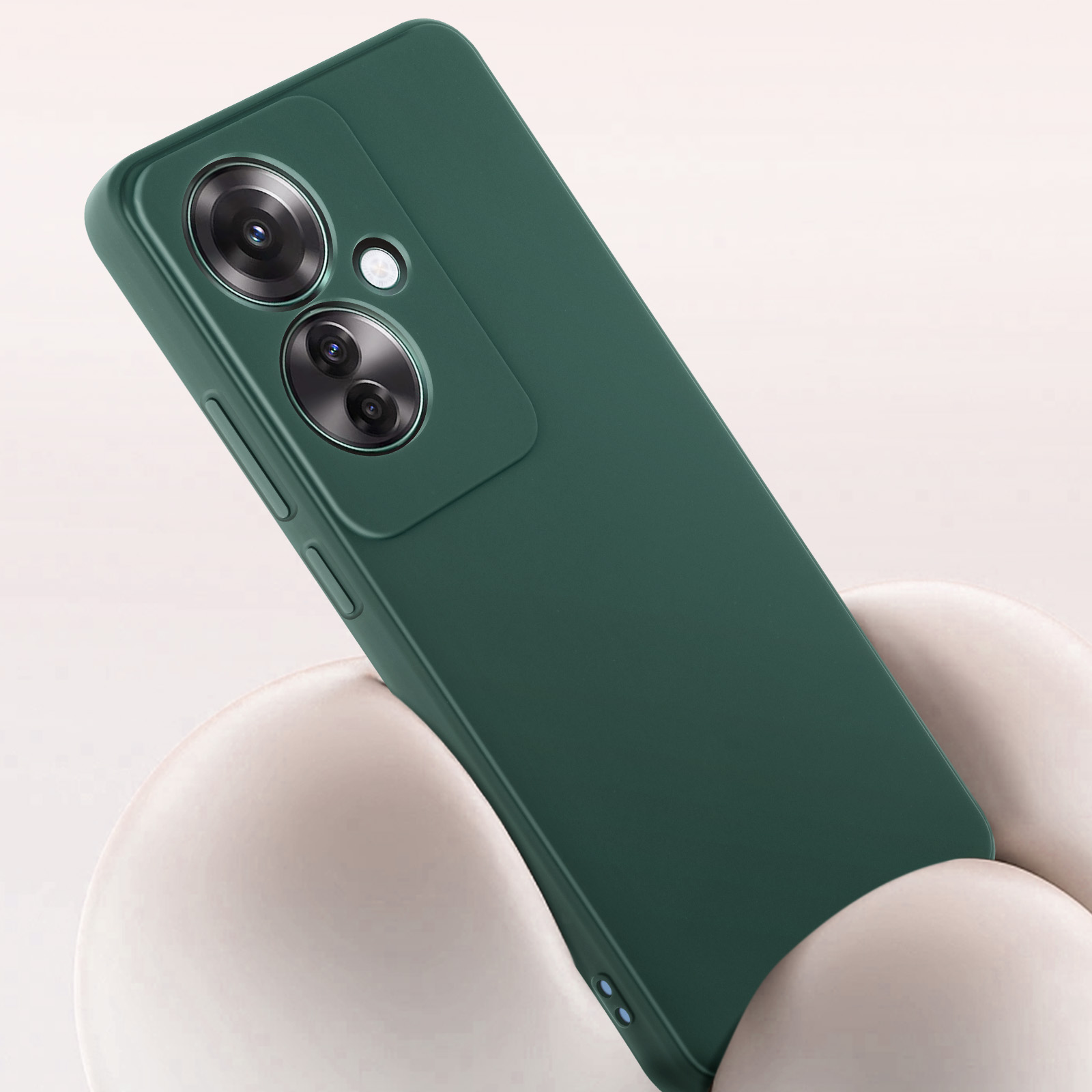 Custodia verde per telefono con lenti della fotocamera sopra. La custodia è su una superficie bianca.