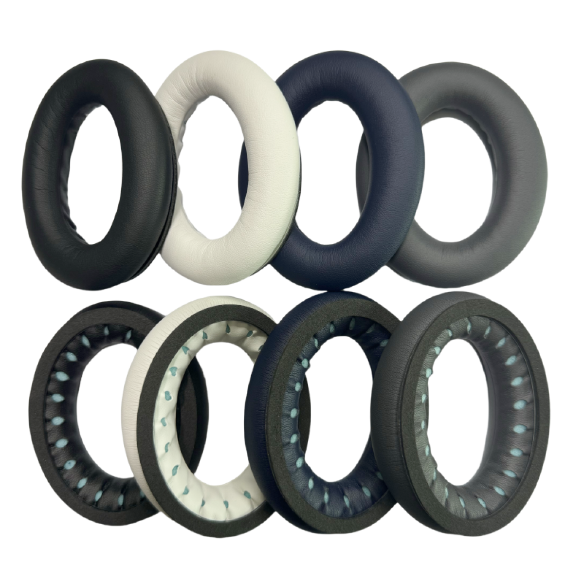 Siedem par nauszników w różnych kolorach: czarny, biały, niebieski, szary, ciemnoniebieski, biały i czarny.