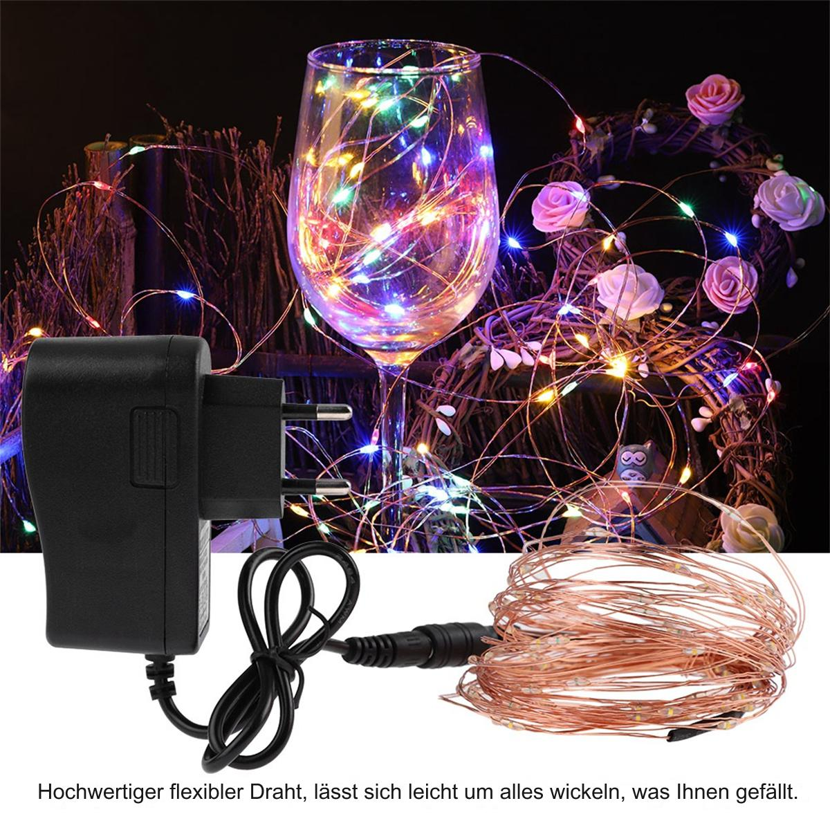 Ein Weinglas gefüllt mit Lichterketten. Ein schwarzer Adapter und Lichter sind abgebildet.