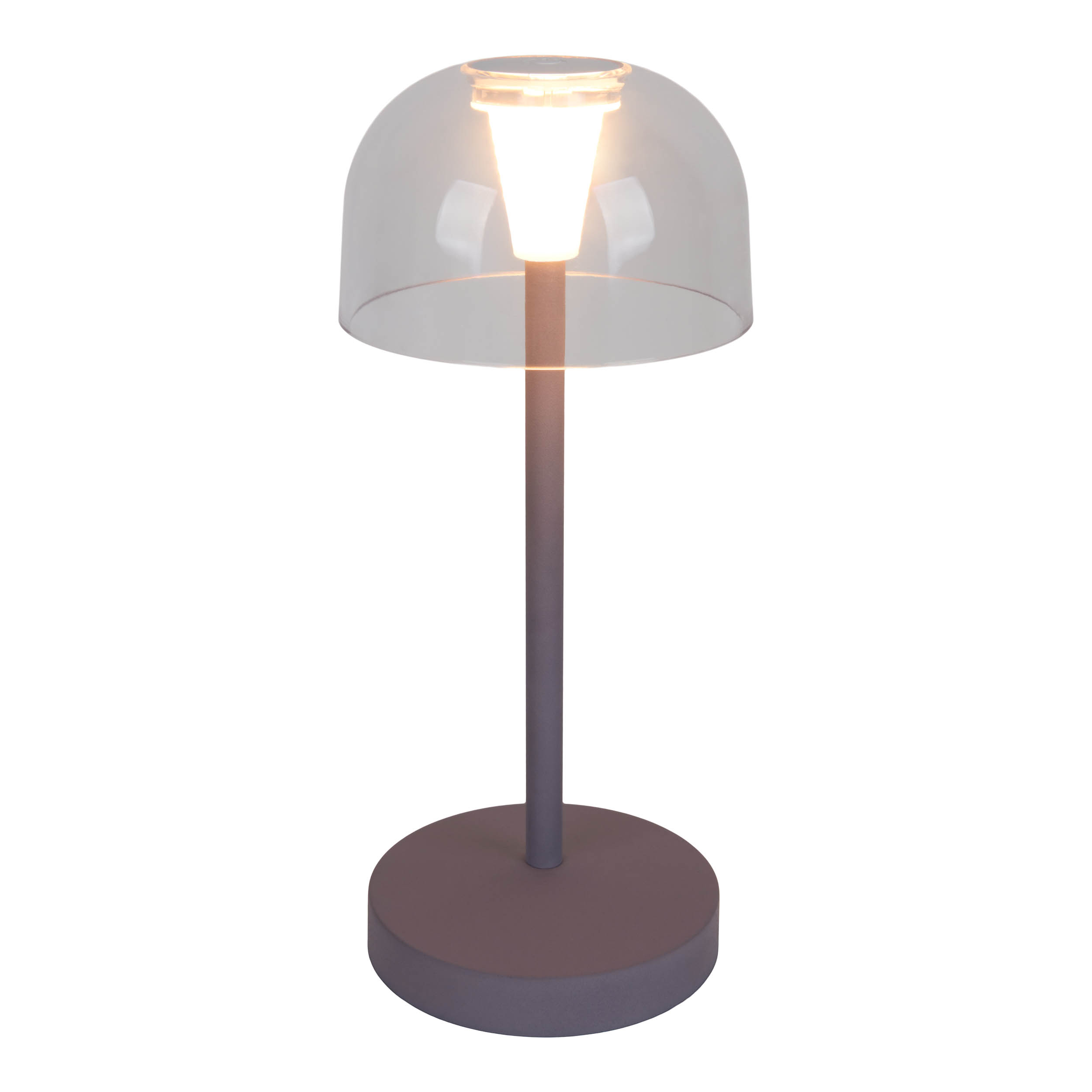 Una lampada argentata con un paralume trasparente. La lampada è su una base rotonda. Lo sfondo è bianco.