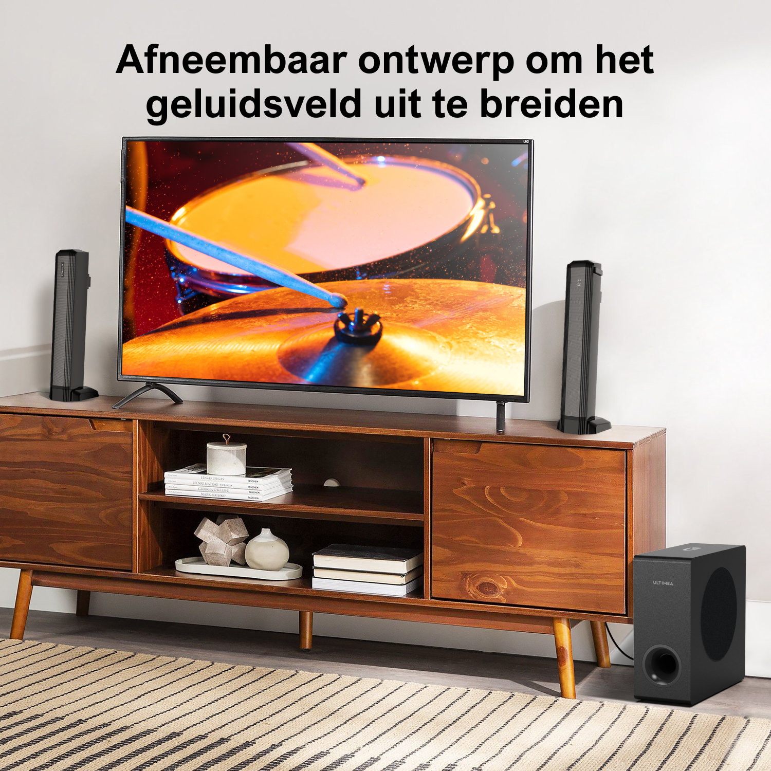 TV with two speakers and a subwoofer. The room has a rug and a wooden cabinet.