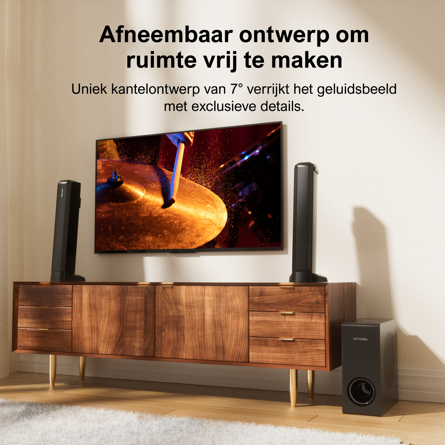 A sound system setup with a TV, soundbar, subwoofer, and two tall speakers, against a white wall.