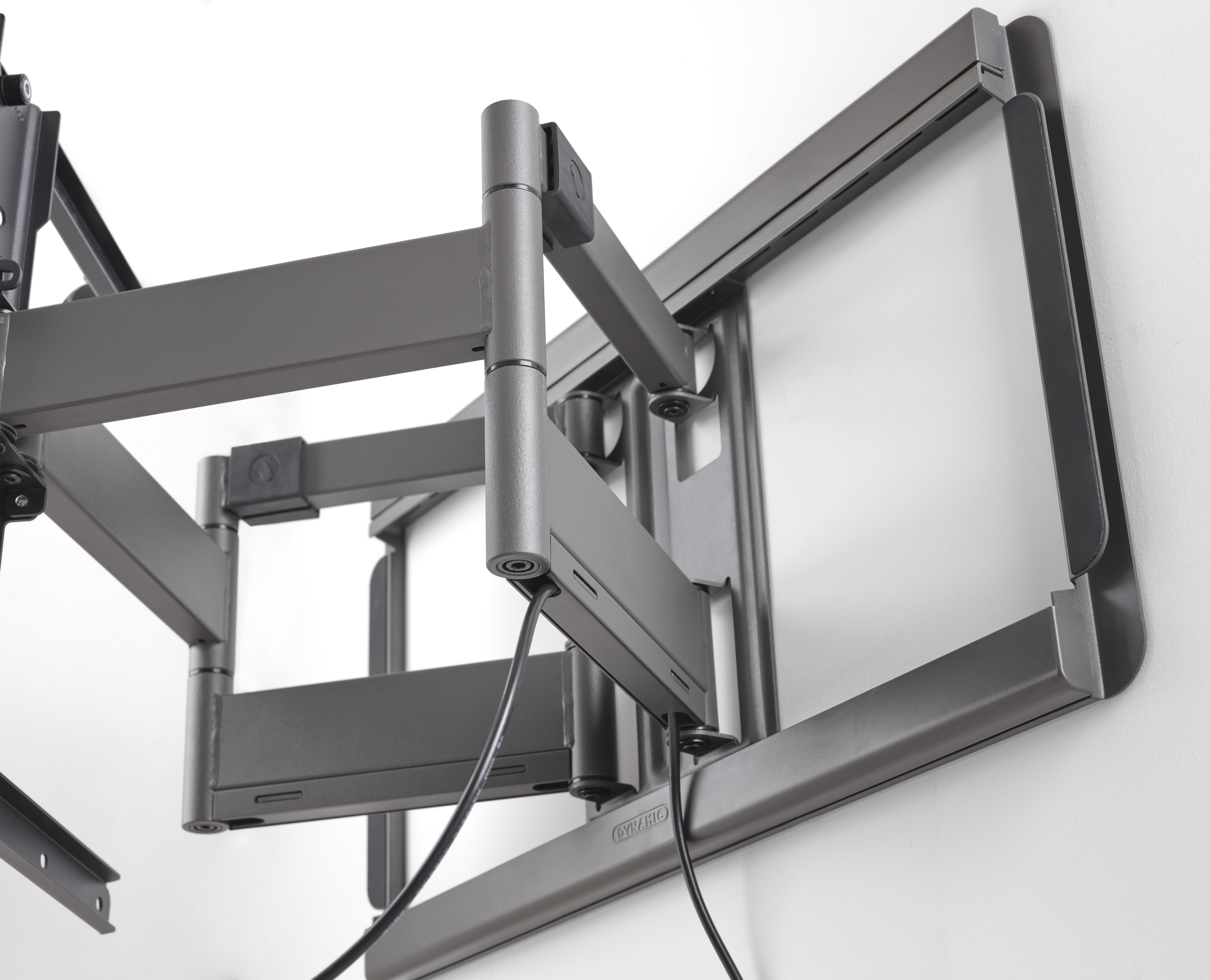 TV mount on the wall. It's gray and has a metal structure.