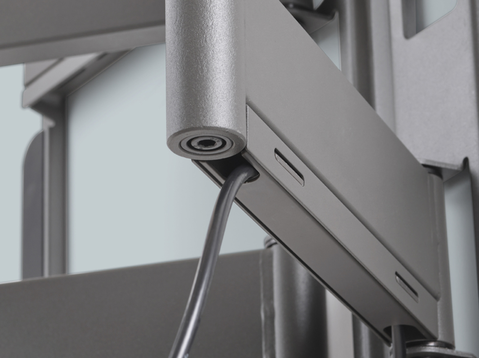 A close-up of the mounting system, with a cable running through it.