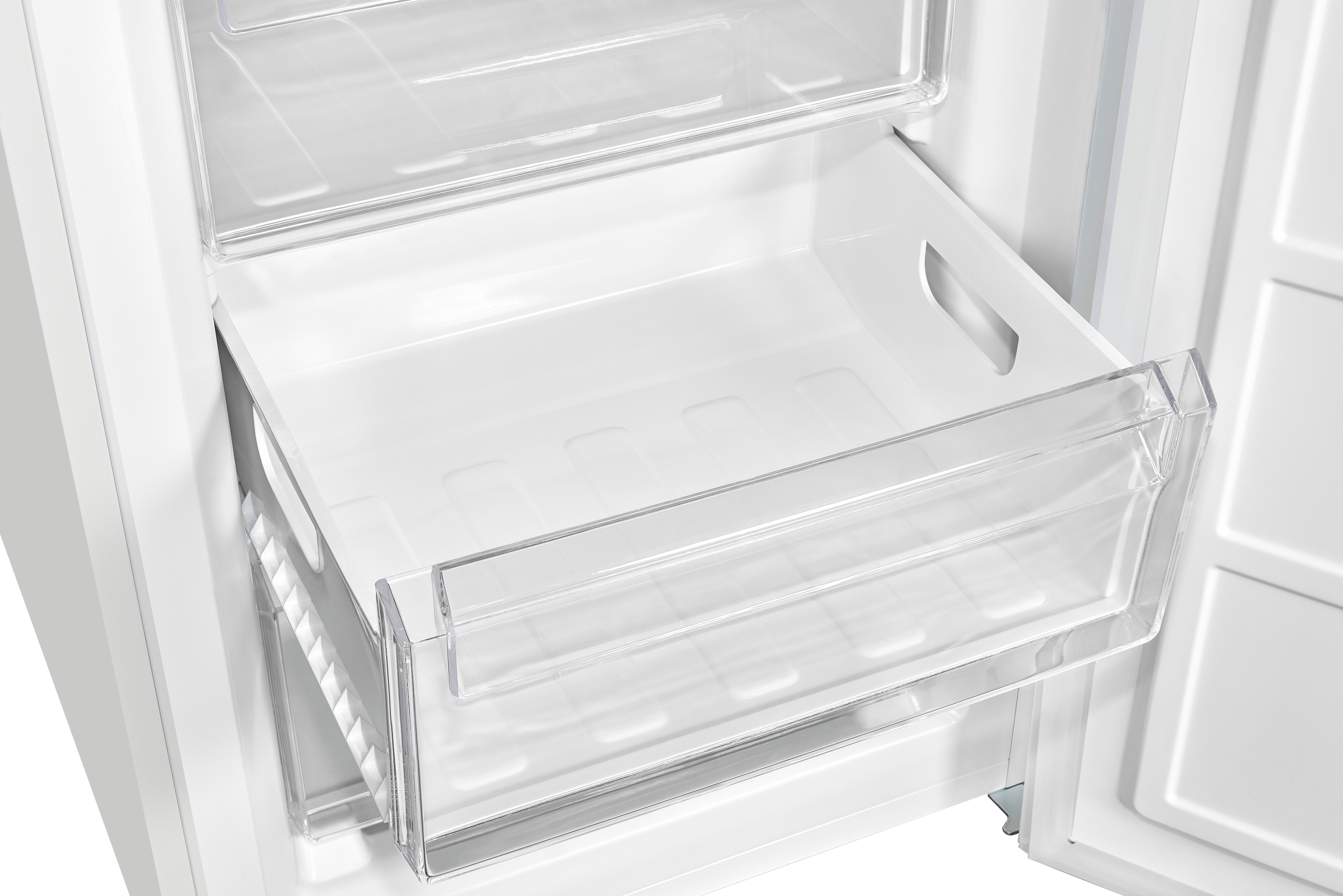 Inside of a fridge, a clear drawer is pulled out.