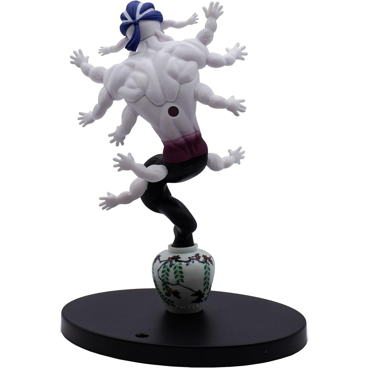 Una figura de varios brazos sobre un jarrón sobre una base negra, un objeto decorativo.