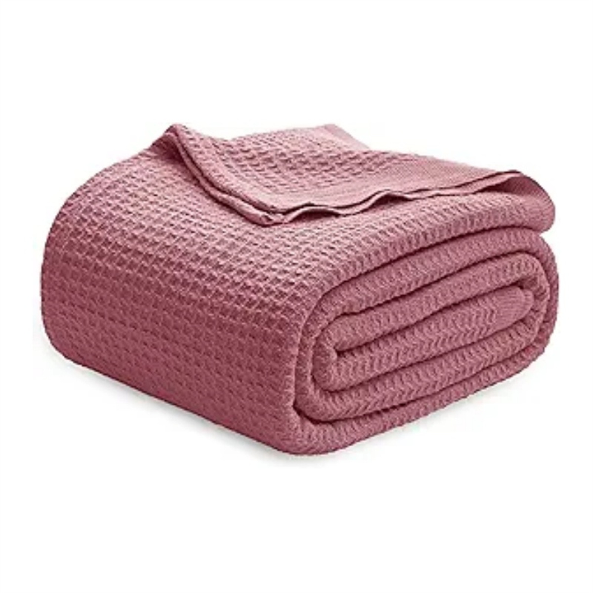 Gerollte rosa Waffeldecke, ordentlich gefaltet. Textur ist sichtbar, zeigt das Waffelmuster.