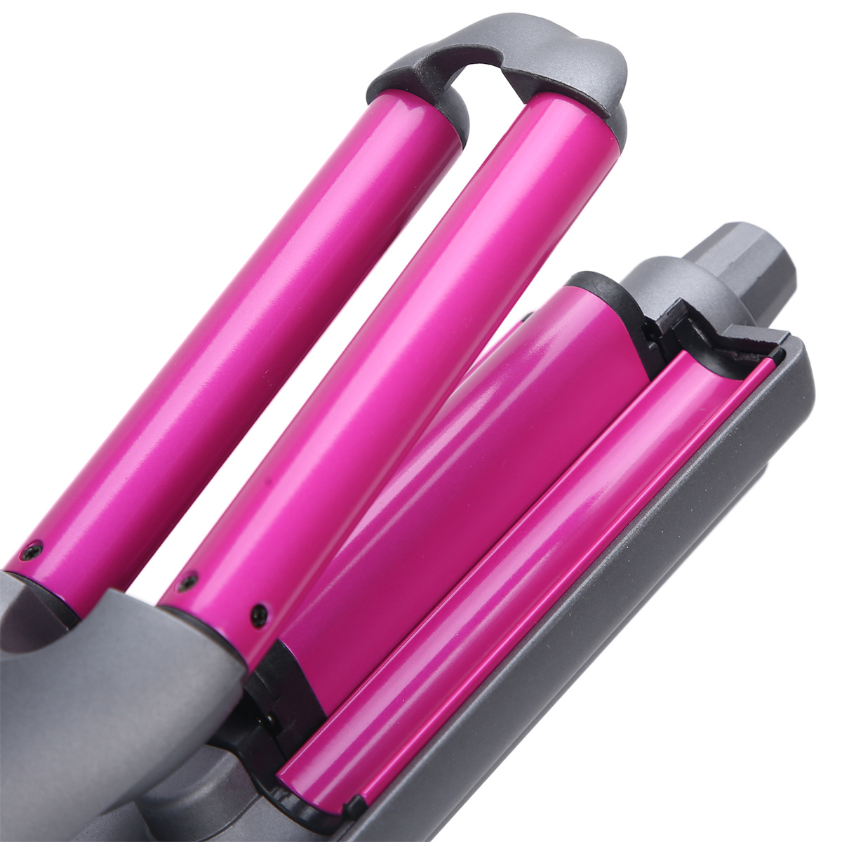 Nahaufnahme eines rosa Lockenstabs mit drei Heizstäben.