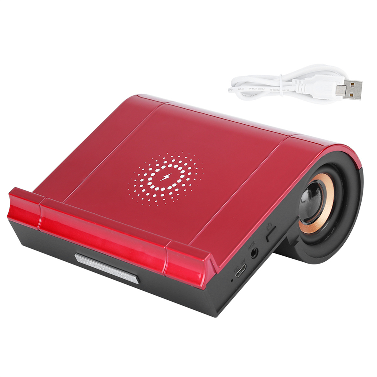 Ein roter und schwarzer Lautsprecher mit kabelloser Ladestation und USB-Kabel.
