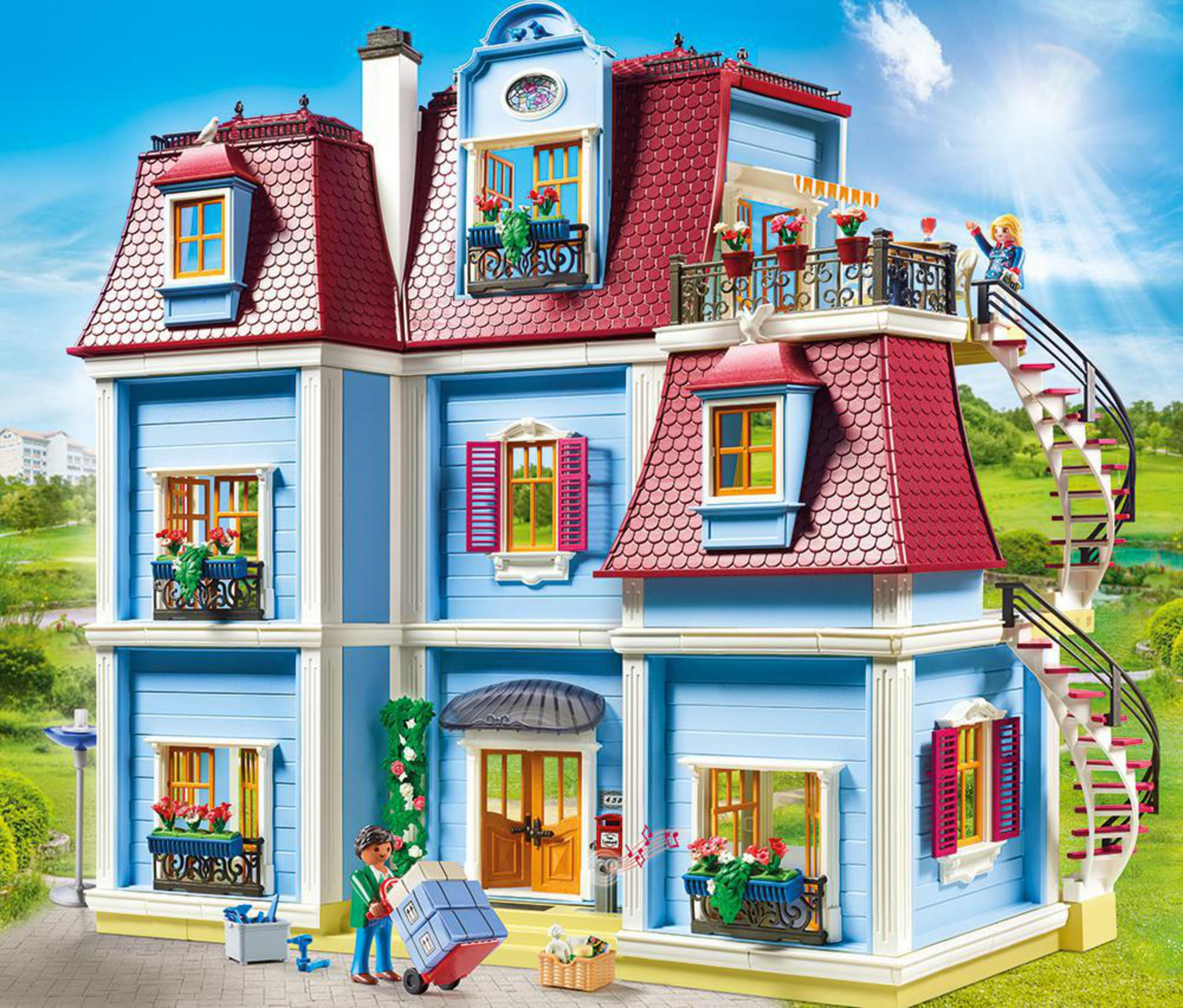 Domek dla lalek Playmobil z niebieską elewacją, czerwonym dachem i spiralnymi schodami.