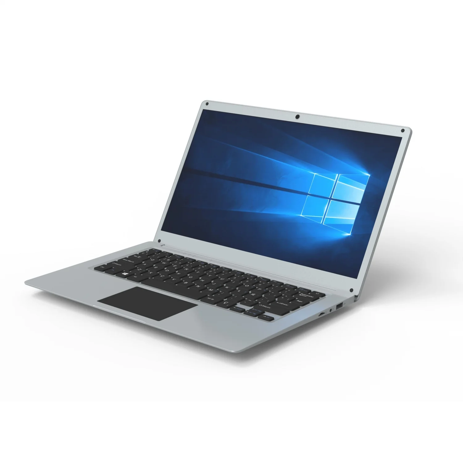 Srebrny laptop otwarty na białej powierzchni, wyświetlający logo Windows.