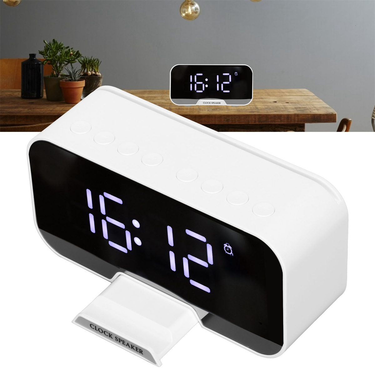 Ein weißer digitaler Uhr-Lautsprecher mit einer Anzeige, die 16:12 zeigt. Im Hintergrund befindet sich eine weitere Uhr.