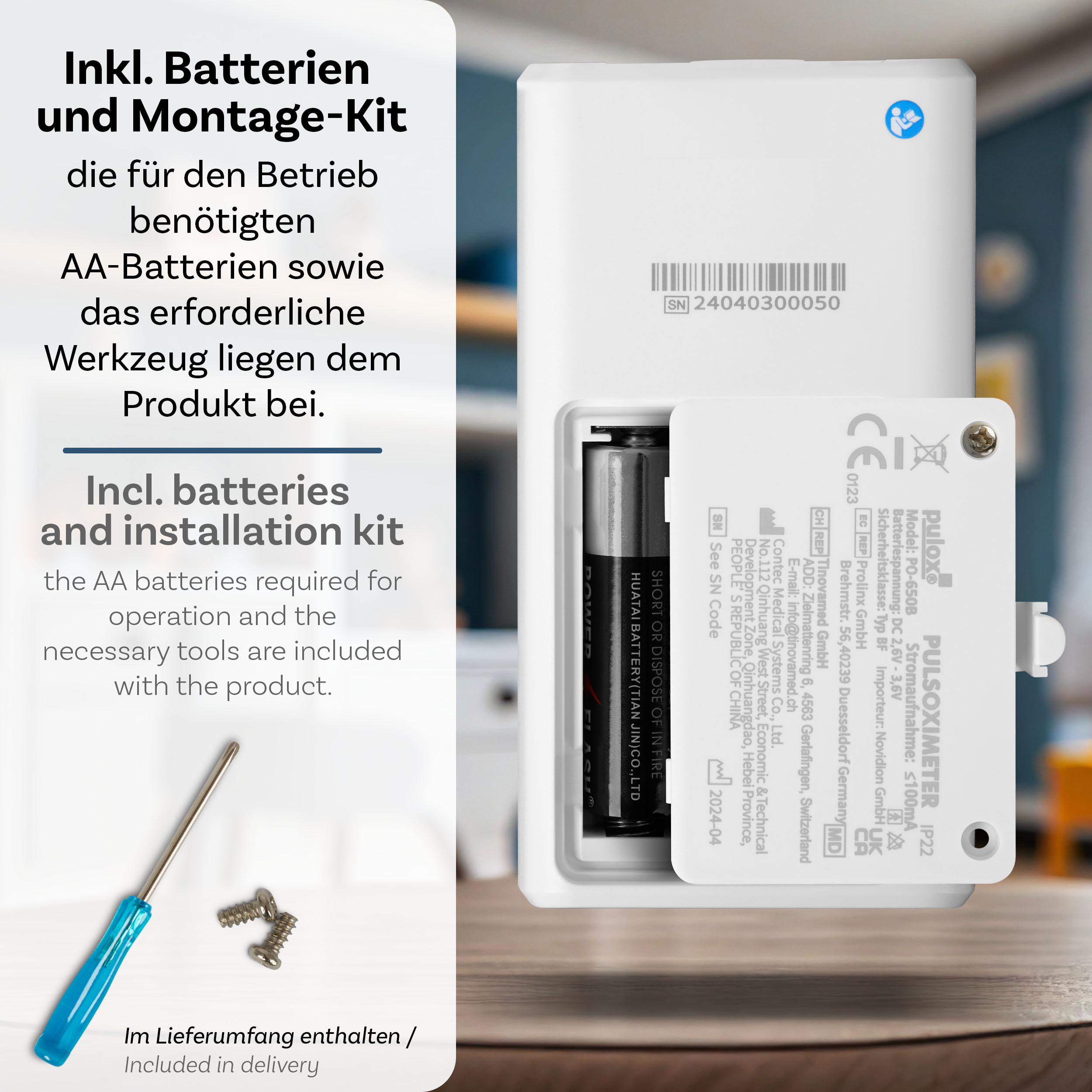 Nahaufnahme einer weißen Box mit AA-Batterien, einem Schraubendreher und Text auf Englisch und Deutsch.