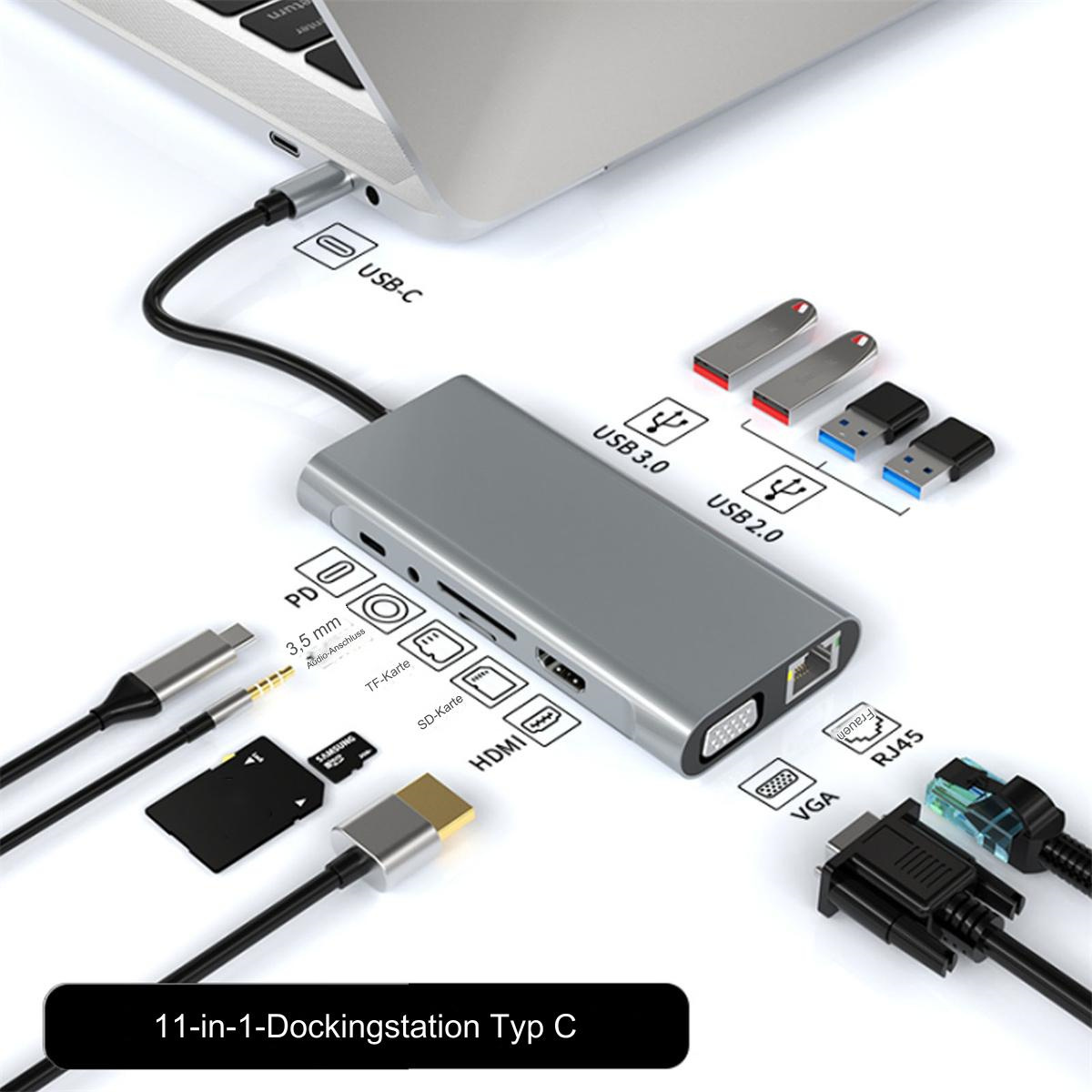 Laptop, der mit einer grauen Dockingstation mit Kabeln und USB-Laufwerken verbunden ist.