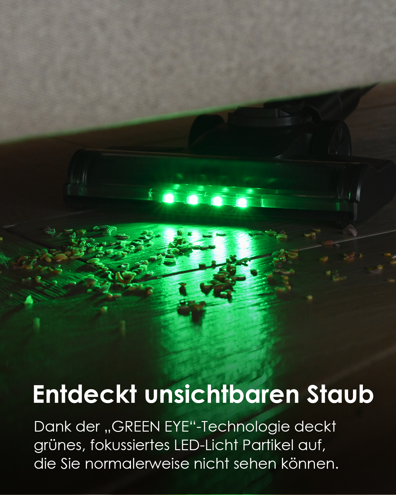 Staubsaugerkopf mit grünen LED-Leuchten auf einem Holzboden.