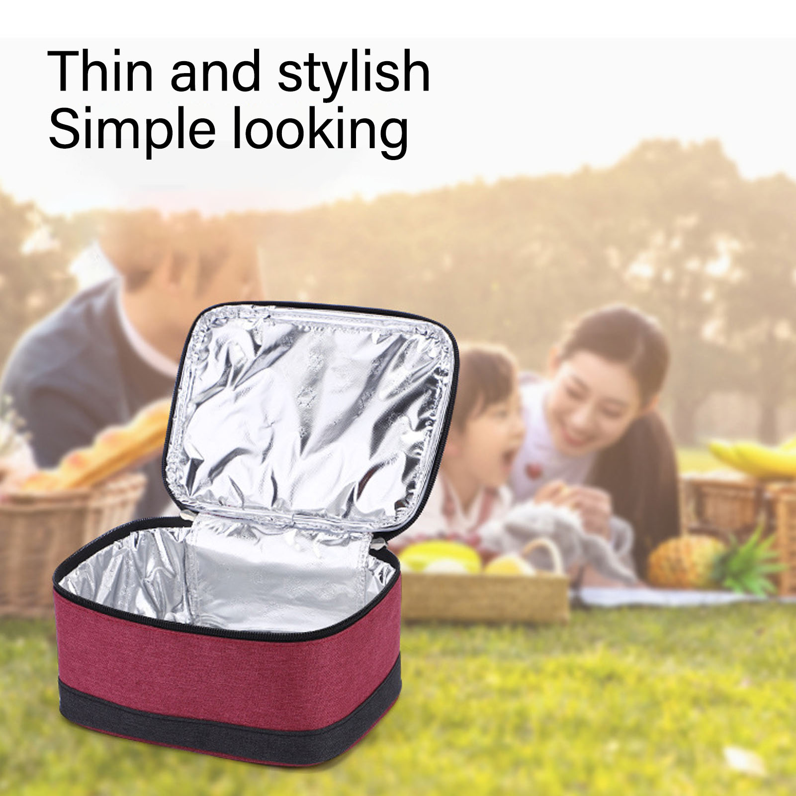Geöffnete isolierte Lunchtasche mit Essen. Eine Familie picknickt im Hintergrund.
