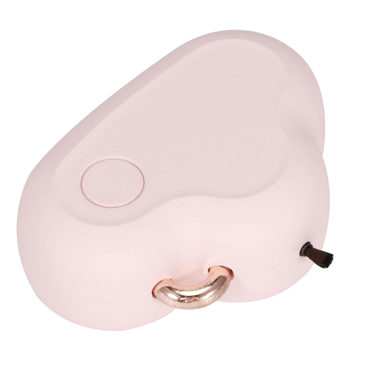 Ein pinkfarbener Gesichtsreiniger mit Bürste und goldenem Ring.