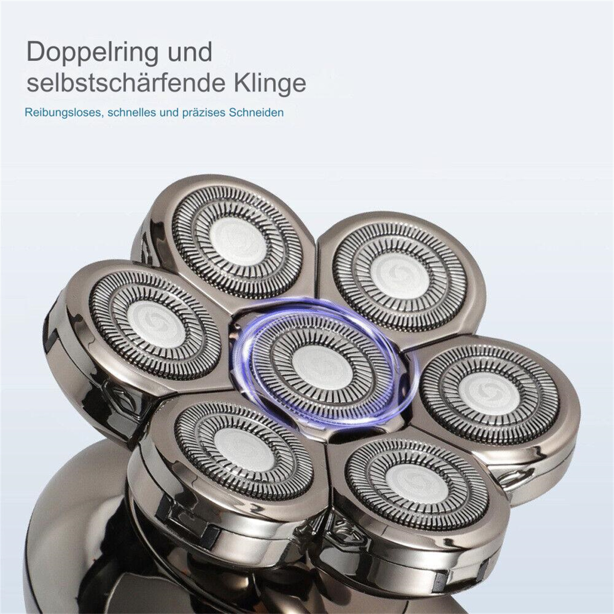 Nahaufnahme eines Rasiererkopfes mit mehreren kreisförmigen Klingen. Die mittlere Klinge ist beleuchtet.