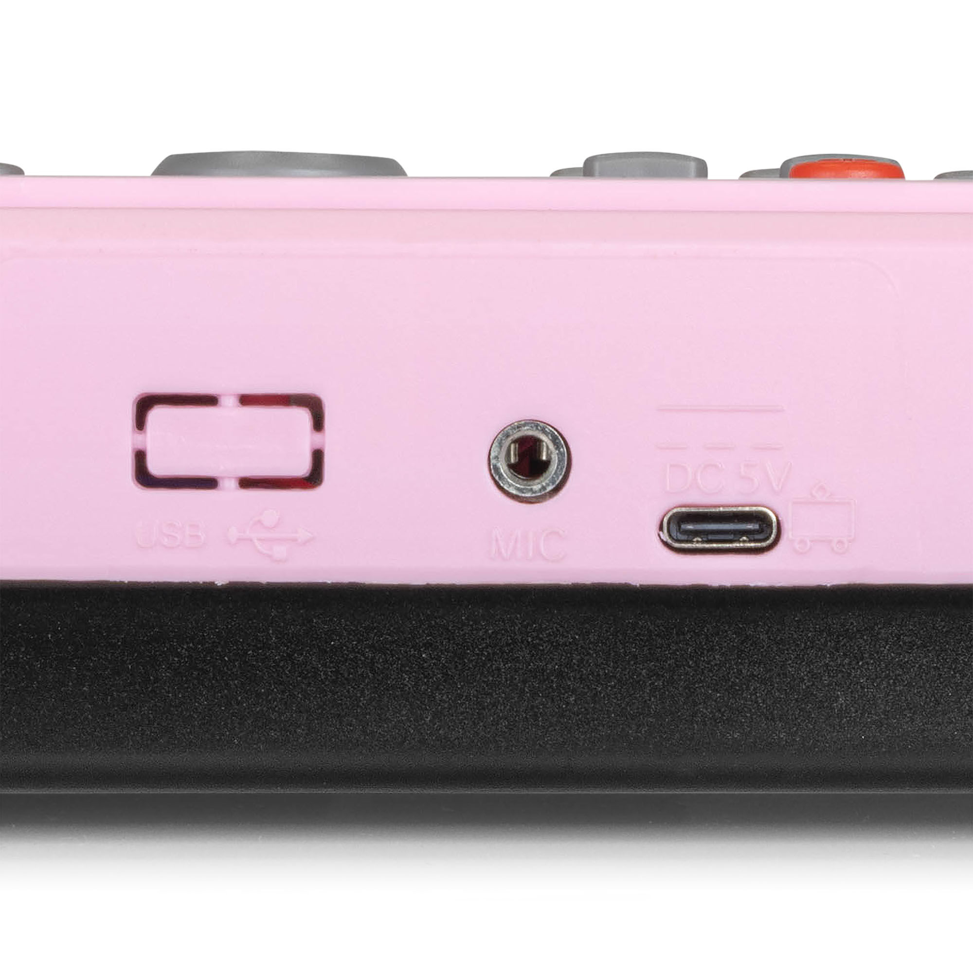 Een roze apparaat met aansluitpoorten: USB, MIC en DC 5V. Een close-up van de zijkant van een product.