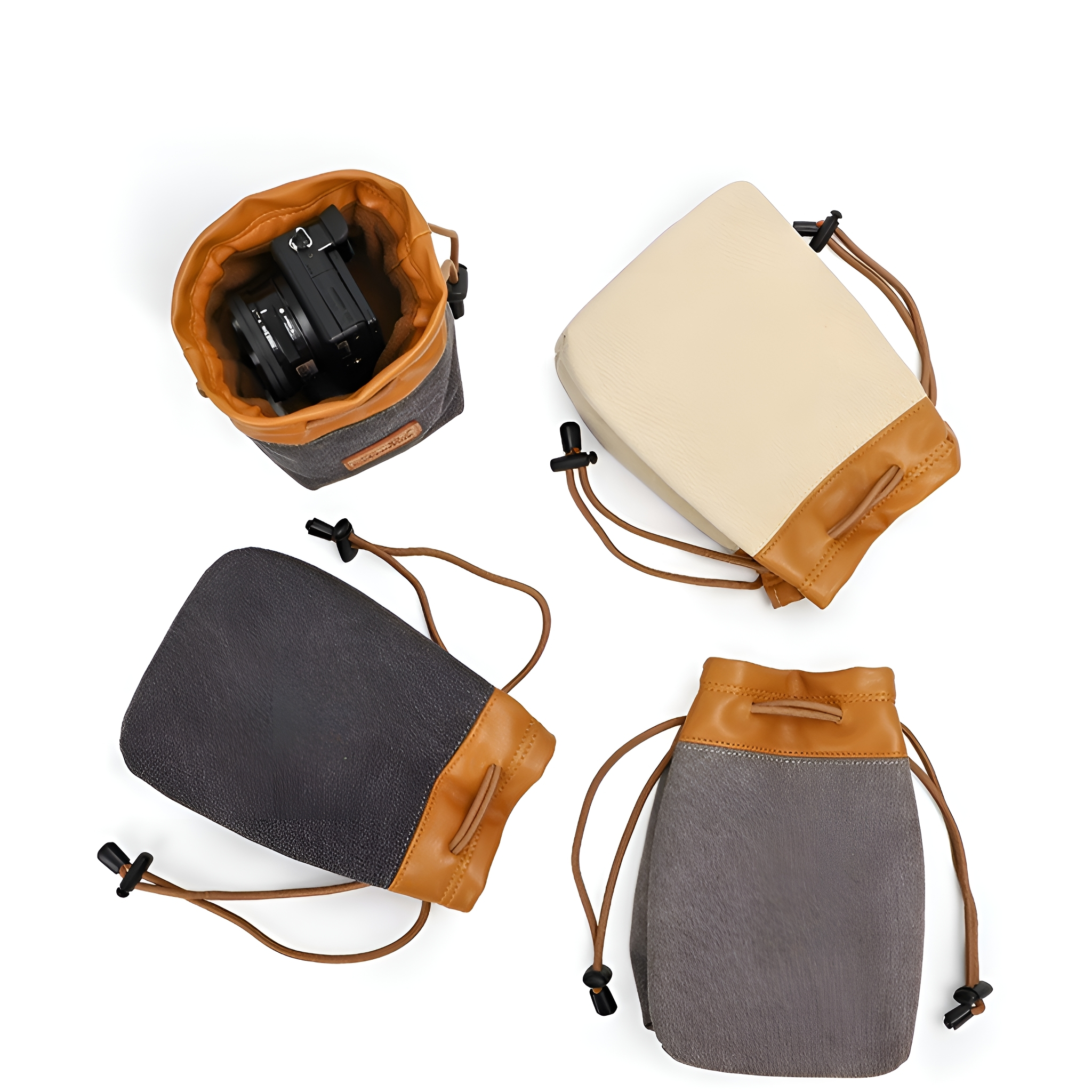 Kamerobjektiv-Taschen in Vogelperspektive. Verschiedenfarbige Taschen mit Kordelzügen und Lederakzenten.