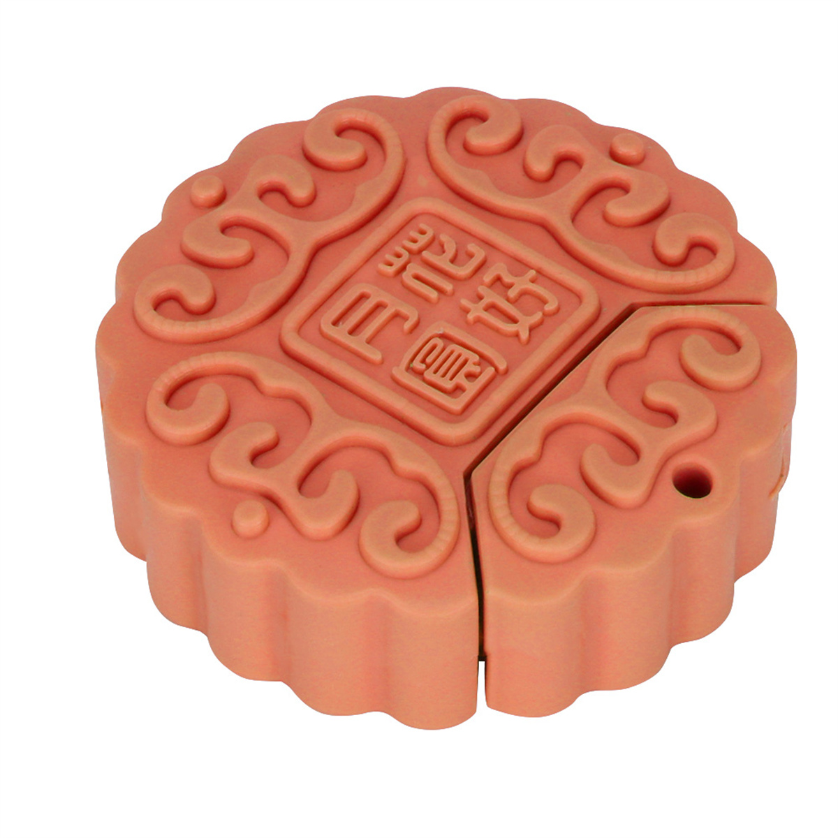 Ein pfirsichfarbener USB-Stick in Mondkuchenform. Es hat chinesische Schriftzeichen darauf.