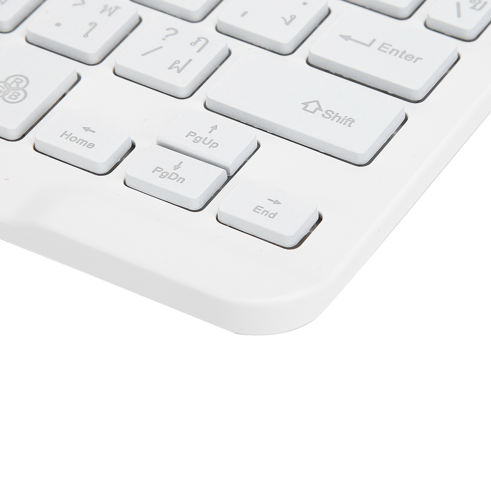 Nahaufnahme einer weißen Tastatur mit weißen Tasten und Symbolen.