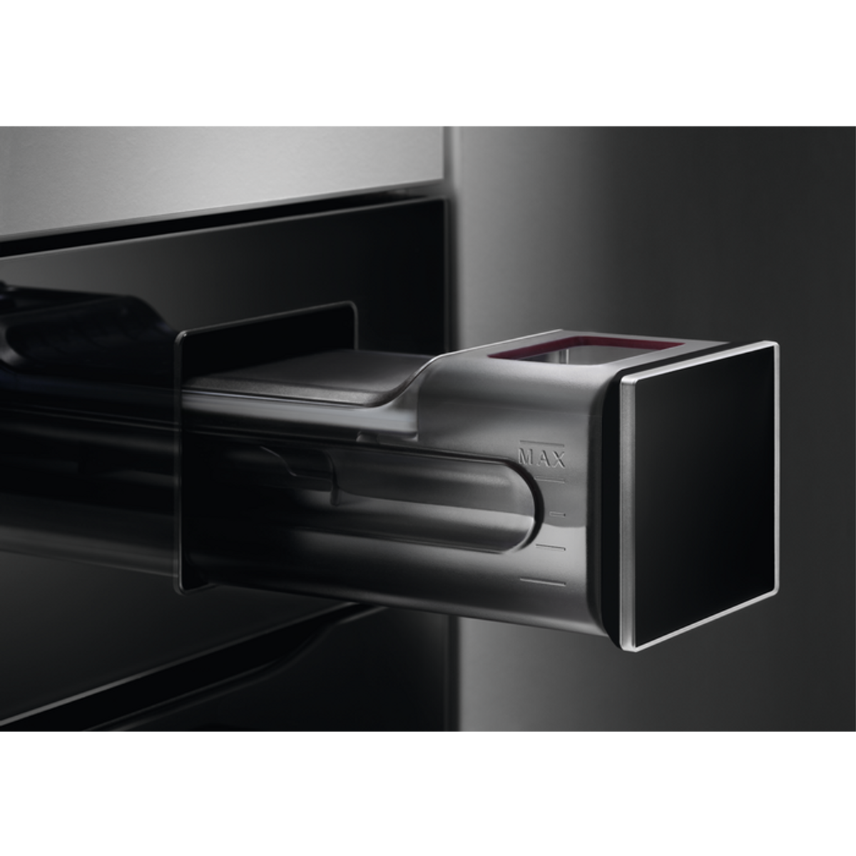 Close-up of a drawer in an oven, showing a metallic handle and a red-lit compartment.