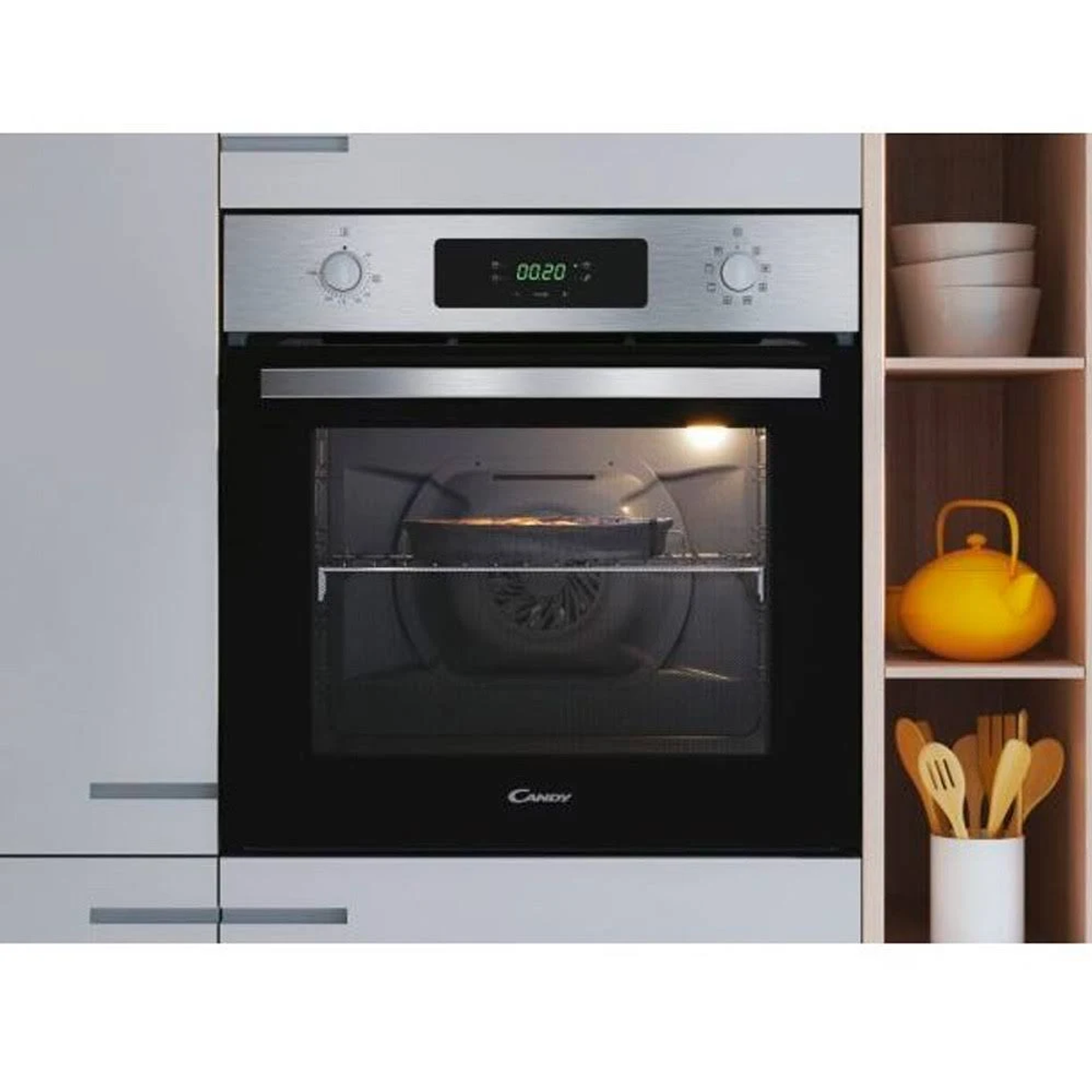 Forno a incasso che mostra l'ora sullo schermo. Ci sono manopole su ogni lato.