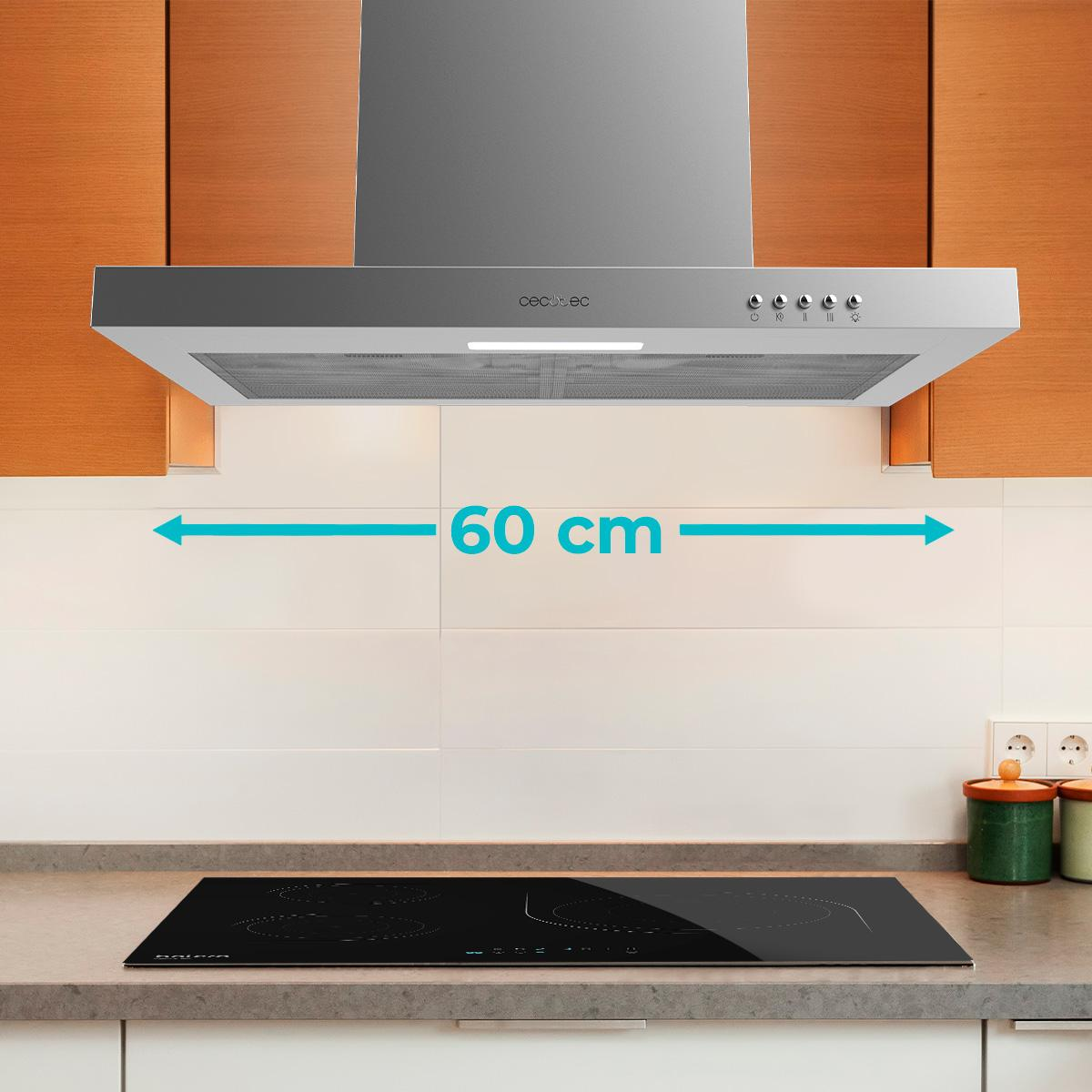 Una campana extractora plateada sobre una placa de inducción negra.